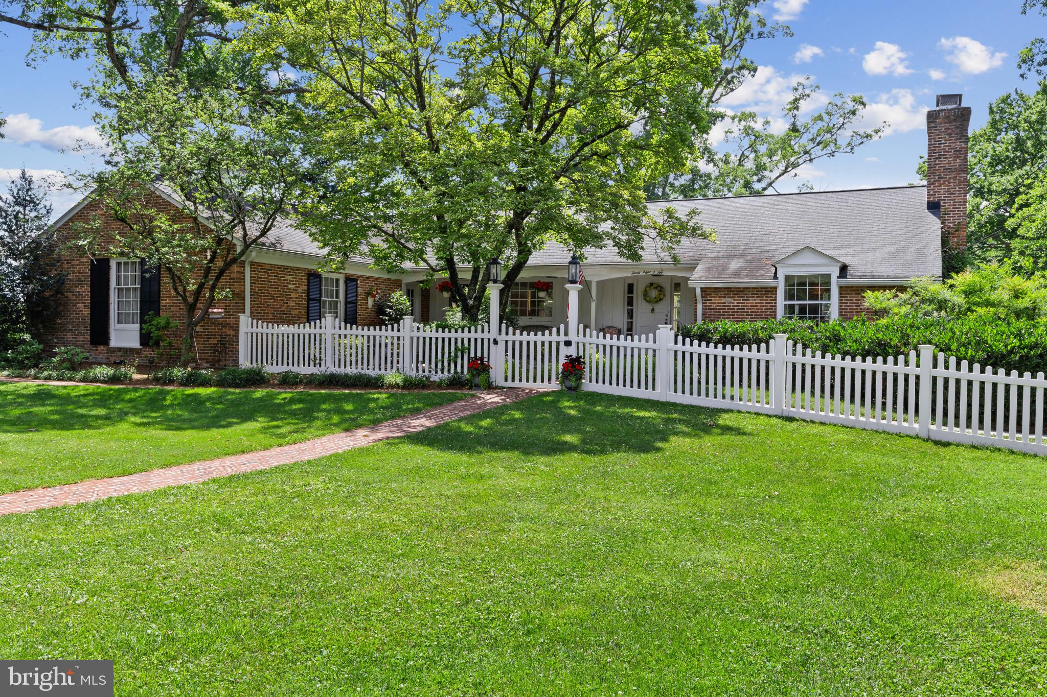 Nestled in the highly sought-after Dunloggin community of Ellicott City, this one-of-a-kind residence seamlessly blends timeless charm with thoughtful, high-end renovations. Rich in character and warmth, every detail has been carefully curated to preserve the home's unique appeal while providing the modern comfort today's buyer's desire. New water heater (2023), new Furnace and HVAC (2024)
The heart of the home is the beautifully renovated kitchen, highlighted by a stunning walnut island, champagne bronze hardware, porcelain tile backsplash, custom woven wood light filtering shades and quality finishes that create both elegance and functionality. Sunlight pours throughout the home, showcasing inviting living spaces designed for gathering, entertaining, and everyday living.
The main level offers the convenience of a spacious primary suite complete with a private ensuite bath and dedicated laundry room, creating a true single-level living option. Upstairs, the sunroom provides expansive views of the beautifully landscaped property.  The perfect setting for casual dining, entertaining guests, or comfortable seating for a quiet afternoon. 
The lower level serves as a private retreat of its own, featuring four sun filled additional bedrooms all with garden views, two full bathrooms, spacious family room, and a second laundry area with bonus space. Whether accommodating extended family, guests, or creating flexible work and recreation spaces, this level offers exceptional versatility. Step outside to a screened-in patio that overlooks the thoughtfully designed hardscape patio and expansive fenced backyard, creating a peaceful outdoor oasis.
Adding to the home's charm is a picturesque brick courtyard just off the front porch—an ideal spot to enjoy morning coffee, unwind after a long day, or gather with friends on a beautiful evening.
Rarely does a home offer such a perfect balance of historic character, thoughtful renovations, flexible living spaces, and exceptional outdoor entertaining areas. This is more than a home—it's a lifestyle opportunity in one of Ellicott City's most beloved neighborhoods.