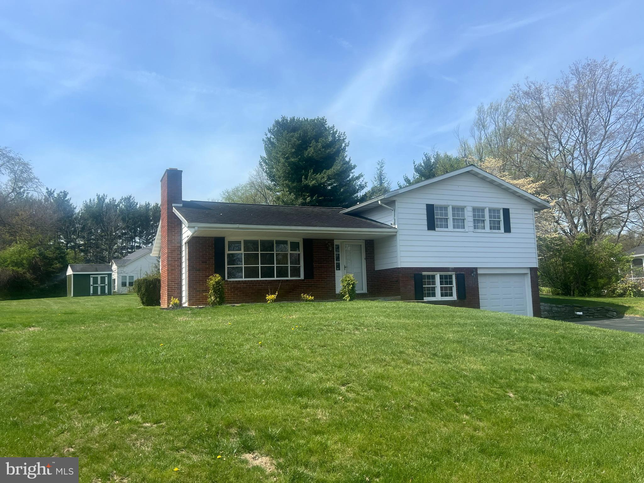 Great Home in sought after North End of Hagerstown. Nice neighborhood, quiet out of the way street and close to all ammenites. The home offer 3 bedrooms and 1-1/2 baths. Eat in Kitchen, Dining room, Living room with natural stone wood burning fireplace, finished 14x22 lower level family room and another level perfect for and office and small den area. Oversized 1 car attached garage with automatic opener. Extra wide driveway for multiple parking spaces.  Brand new patio, large lot, almost 1/2 acre with garden shed and Rock Garden. Newly updated septic system in April of 2025. The home has been freshly painted and beautiful newly finished hardwood floors. Corian counter tops and new dishwasher. Move-in ready and waiting for it's new owner.