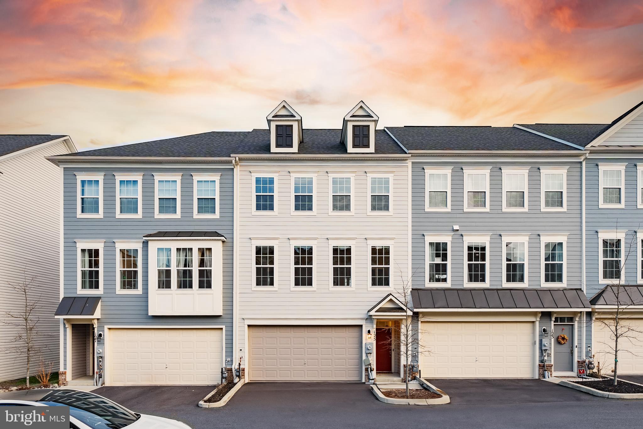 Welcome to this meticulously maintained gem by the original owners in the highly sought-after Travilah Station community! This  stunning 3 bedroom, 3 full baths, 1 half bath unit expands over 2700sqft which is the LARGEST model unit within the community that is built on a PREMIUM LOT with FULL of unique features that will make you fall in love! Aurora II model offers the abundance space with the latest modern design and comfort without the wait of new construction! 
Enter into the home, greeted by stunning custom molded walls leading to the massive open living space.  Step right onto the custom brick patio for al fresco dining or relaxation. Perfect for entertaining or unwinding after a long day. This impeccable townhome adorned with upgraded wood planks on all living areas. The open-concept kitchen is a chef's delight, featuring quartz eat-in tops ideal for breakfast, light entertainment, high-end GE stainless appliances, double ovens, built-in microwave, gas range with up-to-ceiling hood ideal for cooking, and a large stainless steel sink. Upgraded kitchen cabinets with beautiful matte black handles and fixtures that amplifies the beauty.  The kitchen is a dream chef's kitchen! The spacious OPEN FLOOR PLAN layout seamlessly connects living, dining, and kitchen areas while still offering the private dining room perfect for family dinners and friends gathering. Through the french double doors, enjoy the elegant office space ideal for remote work or as a quiet study nook. Walk out to the enormous deck to enjoy the beauty of serene view of endless greenery and privacy. You will find tranquility and privacy of your own wooded oasis all seasons! This luxurious home BOASTS WITH UPGRADES - CUSTOM MOLDING throughout, ELEGANT ACCENT WALLS, BUILT-IN SHELVING with added sophistication and design touches in every room.
The luxurious Owner's Suite boasts with walk-in closet, double vanities and frameless walk-in shower and high-end tub perfect for a warm jacuzzi.  Wake up to the bonus SUNRISE view EVERY morning! HIGH END FRONT LOADING LG Washer and Samsung Dryer are located on the bedroom floor allow for convenience with a separate closet with CUSTOM BUILT-IN shelving gives you maximum storage. Two additional bedrooms equally spacious in size and equip with elegant modern ceiling fans with light. 
Walk out of the home and you will greeted by GREENERY and open community gathering area with walk paths, tot lot-playground right around the corner of your front door. UNIQUE to this home is AMPLE  GUEST PARKING right in front of the home in addition to the 2 car attached garage, two car in the driveway - welcome all your guests! 
Conveyed: All upgraded blinds, curtains, Ring security system with camera, Ecobee Smart thermostat. 
Located in the Montgomery County School District, this home ensures an excellent education for your family. Recently recognized Blue Ribbon School Stone Mille ES, Cabin John MS, Thomas Wootton HS! 
Boasts with convenient amenities, Just a 5-minute walk to Trader Joe’s and the nearby shopping center, lakes, parks, theaters, minutes away from Rio, Downtown Crown, Kentlands, Pike and Rose, and Rockville Town Square.
Commuting made simple with quick access to major highways the ICC-200, I-270 commuter exits making your commute a breeze.
This spotless townhome has truly has everything you need from top schools, modern luxury living,  convenience, nature scenery, and so much more. Schedule your tour today! It won't last long!