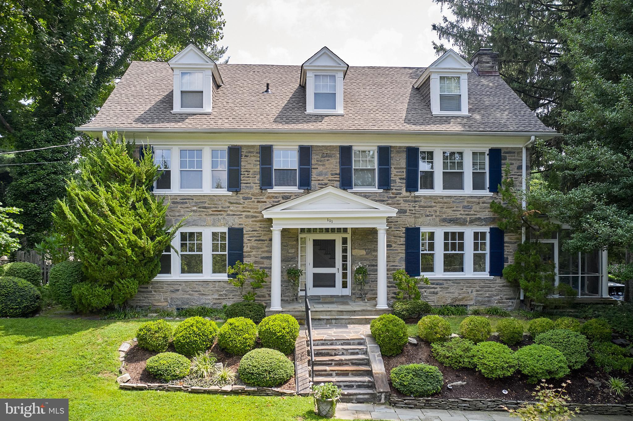 Welcome to 111 Saint Georges Road, an elegant and timeless center hall, 3-story, stone colonial nestled in the heart of Ardmore, Pennsylvania. This exquisite residence boasts 5 bedrooms, 3.5 bathrooms, and 4,014 above-ground (+ 1,494 below-ground) square feet of living space, all on a generous lot spanning .42 acres with lovely, perennial flower beds watered automatically by an eight-zone sprinkler system.  As you step inside, you'll be greeted by the majesty of large, oversized windows that flood each room with natural light, illuminating the beautiful wood floors and highlighting the meticulous attention to detail in the millwork throughout the home.  The living room features a captivating gas-burning fireplace, while an adjacent high-ceiling screened-in porch offers a serene retreat for relaxation and entertainment. The home's all ceramic-tile bathrooms and main bathroom with heated floor exemplify the commitment to luxury and comfort.  The wonderful, expanded kitchen, with gas cooking and an attached breakfast room, provides a picturesque view of the expansive backyard, creating a perfect setting for everyday dining.  Step outside to discover the allure of the inground pool with Polaris self-cleaner, surrounded by a flat backyard with mature plantings that offer maximum privacy.  A brick terrace with water features of waterlilies provides an ideal outdoor entertainment and relaxation space.  The basement provides two egresses, one to the garage and the outside, and offers possibly additional areas for family and friends’ activities.  This remarkable property ensures functionality and ease of living for the discerning homeowner.  With its timeless charm, luxurious amenities, and thoughtful design, 111 Saint Georges Road presents an unparalleled opportunity to experience the epitome of gracious living in Ardmore.  Couple all this with its proximity to Ardmore’s Amtrak (easily connects NYC) & Septa transportation, and Suburban Square, with its convenient shopping and entertainment, and great schools (located in “option zone”), you have, simply, a must-see!