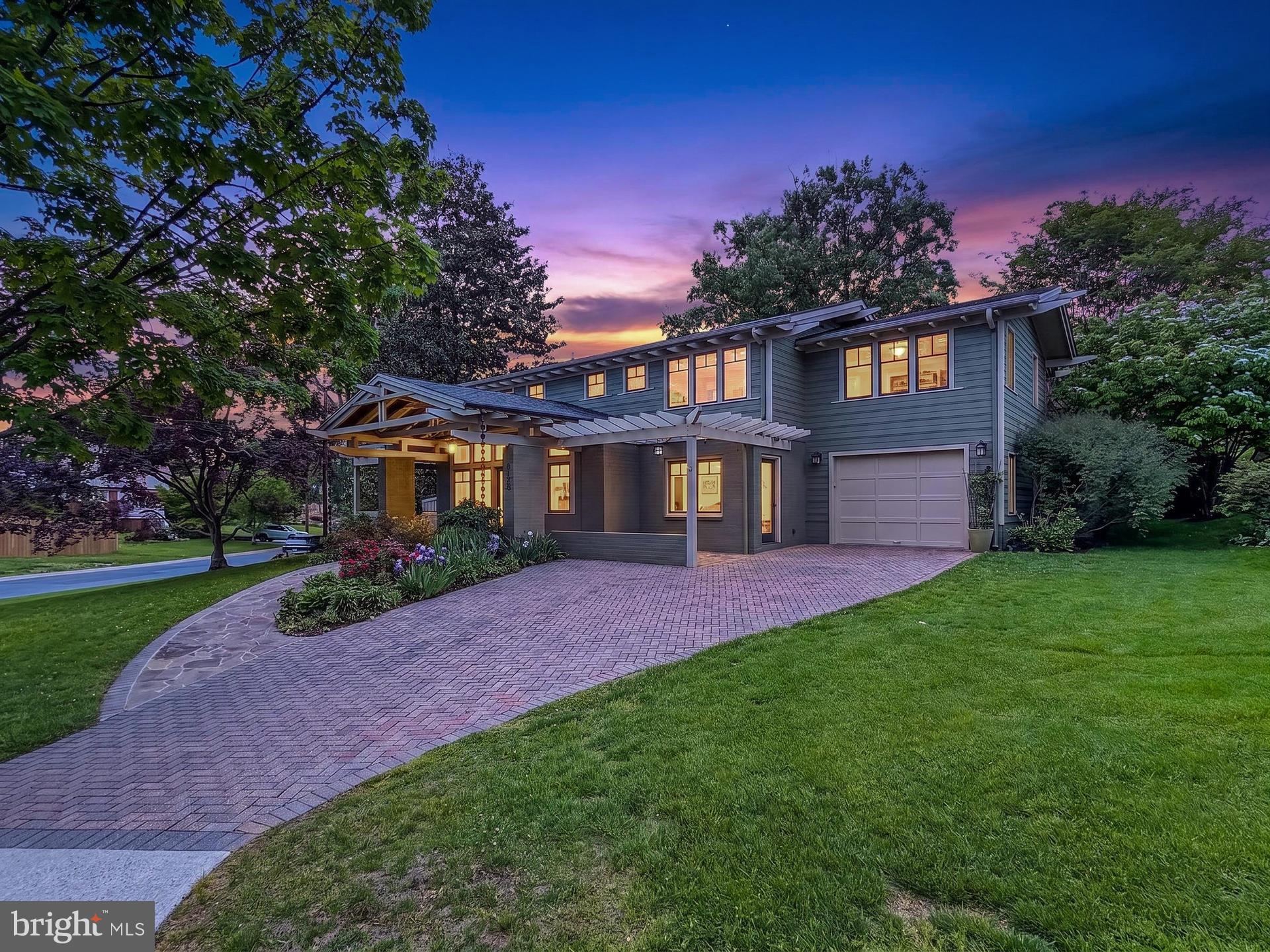 Set on a beautifully positioned corner lot just steps from nature, this exceptional home stands out with arguably the best curb appeal in the entire neighborhood and has been impeccably maintained. Originally built in 1959 as a Colonial, this gorgeous 4-bedroom, 4.5 bath home was fully renovated and transformed in the Arts & Crafts style in 2013 by DC architect JC Cummings. Freshly painted inside and out, the home offers three finished levels of thoughtfully updated living space infused with countless upgrades. ***** A striking brick and Hardiplank exterior with a custom brick paver driveway, 1-car garage, slate walkways and covered front and side porches, expert landscaping, covered rear porch, large stone patio with stacked stone sitting walls, and a lush, fenced backyard surrounded by trees and privacy plantings create instant outdoor appeal. ***** Inside, you’ll find an open floor plan, oak hardwood flooring, decorative moldings, custom built-ins, high ceilings and an abundance of easy to open and clean windows in every room filling the space with natural light. An open foyer with a soaring ceiling and walls of windows welcomes you, as rich hardwood flooring flows into the spacious living room with built-in oak bookcases, the family room/office with a cozy fireplace and the dining room accented by chair rail and chic pendant lighting. The adjoining kitchen remodeled in 2021 features an abundance of 42” white cabinetry, gleaming quartz countertops, designer tile backsplashes and stainless-steel appliances. The breakfast area features a custom-built table with matching quartz top and serving/bar area. Step outside to the porch, patio and expansive, private backyard that is a peaceful retreat—perfect for relaxing and entertaining. A powder room and a huge laundry/mud/pet room with supersized 2024 washer/dryer on pedestals and wood cabinets for extra storage complete the main level. ***** Hardwoods continue upstairs into the spacious primary suite with a soaring vaulted ceiling, walls of windows, a separate dressing area with built-in bench with storage, 3 large closets, an extra hidden closet, and a custom laundry chute. The luxurious marble and tile ensuite bath features a vaulted ceiling with skylights, heated floor, custom vanity with moveable sink mirror, a linen closet, water closet, and a huge frameless glass ultra-shower.  Down the hall, a junior suite enjoys a private bath, and two additional bedrooms share the hall bath, while the open loft/reading area can easily be enclosed as a 5th bedroom. ***** The finished lower level provides plenty of space for games, media, and exercise in the expansive multi-area recreation room. A 4th full bath adds convenience, and a second laundry room, unfinished workshop, utility room, loads of storage space, and a large enclosed extra storage area complete the comfort of this wonderful home that reflects true pride of ownership. ***** Ideally located near the Locust Grove Nature Center, Wildwood Shopping Center, Montgomery Mall, and major commuter routes including I-270 and I-495, this home combines suburban tranquility with everyday convenience. Enjoy easy access to Metro, top-rated schools, NIH, and Walter Reed, all while living in a warm, established community known for its charm and walkability. For a home with strong fundamentals, timeless appeal, expert renovations, and the perfect blend of space, style, and comfort in a stellar location, this is it! Beginning interior photos and rear patio have been virtually staged