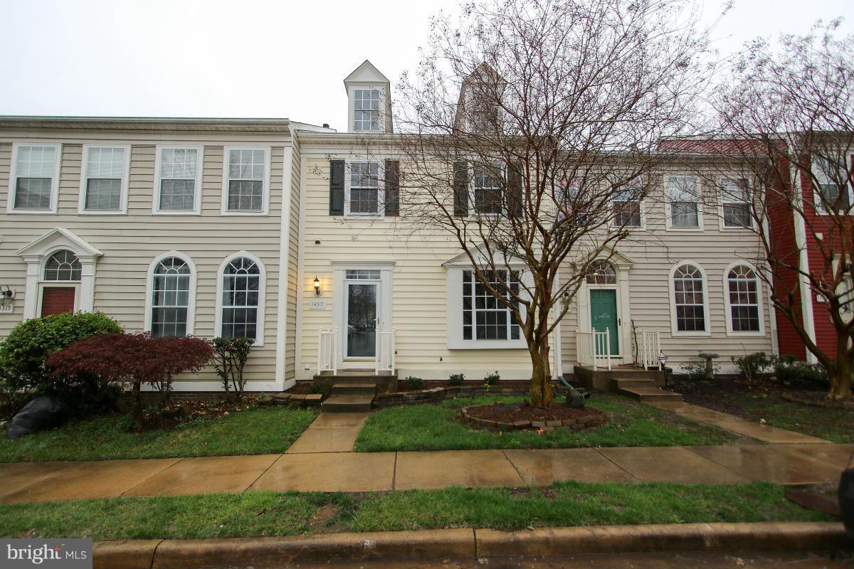 Fantastic Updated & Spacious Townhome Backing to Trees & Pond View! Over 40K in Upgrades. Wood Floors on Main Level w/ 9' Ceilings, Renovated Open Kitchen w/ Island. Master Suite w/ Vaulted Ceilings & Lux Bath w/ Dual Vanity, Sep Tub & Shwr.  2 Decks, Fenced Yard, W/O Bsmt w/ FP & Rough in For Full Bath. Updated High Efficiency Windows & Sliding Doors. Community w/ Pool, Tennis & More!
