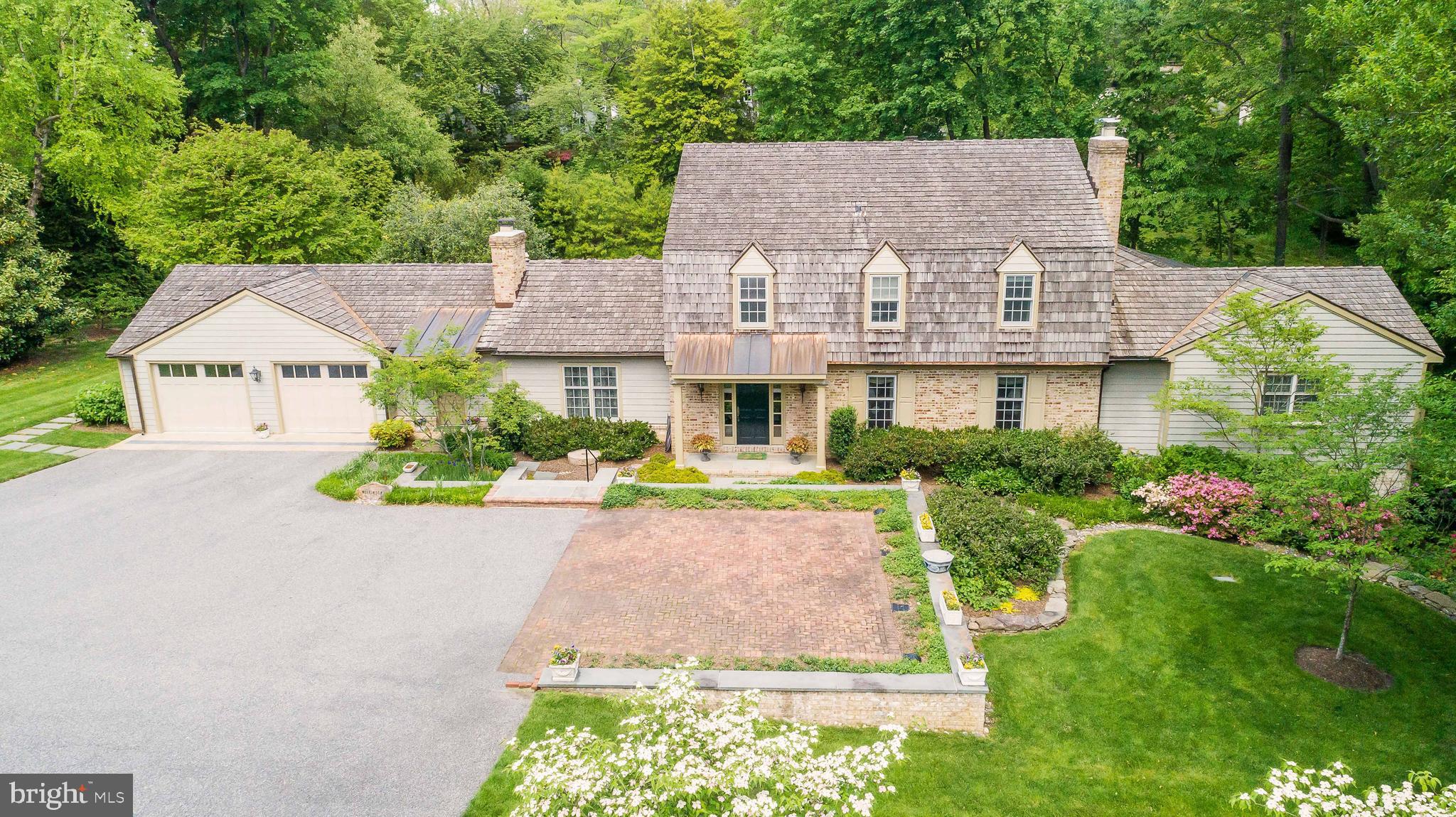 IF A CONVENIENT LOCATION AND A ONE OF A KIND VIEW ARE SOMETHING YOU WISH FOR, THEN THIS HOME IS FOR YOU. UNPARALLELED COMBINATION OF CONVENIENCE AND PRIVACY ARE OFFERED IN THIS MASTERFULLY  REMODELED 5 BEDEROOM 4 1/2 BATH COLONIAL ON .78 ACRES IN SOUGHT-AFTER RUXTON. SO CLOSE TO ALL THE CITY HAS TO OFFER, YET FEEL LIKE YOU LIVE IN THE COUNTRY. ENJOY NATURE FROM YOUR STONE PATIO WITH FOUNTAIN AND PERGOLA OFF FAMILY ROOM OR FROM DECK OR SCREENED PORCH OFF THE FIRST FLOOR PRIMARY BEDROOM SUITE ALL OVERLOOKING YOUR STONE WALLED BACKYARD WITH STONE STEPS TO A STREAM AND TREES. 3 FIREPLACES, GLEAMING WOOD FLOORS, TASTEFUL BUILT-INS, ATTENTION TO DETAIL IN THIS QUALITY REMODEL. WELL PLANNED ADDITIONS OFFER SPACES FOR QUALITY FAMILY TIME OR ALONE TIME OR GRACIOUS ENTERTAINING. ADDITIONS WERE DESIGNED BY PETER RADCLIFFE, INTERIOR DESIGN BY ALEXANDER BAER (JENKINS BAER), LANDSCAPING BY MAXALEA. PUBLIC WATER AND SEWER. GENERATOR SERVICES REFRIGERATOR, GARAGE DOORS, SECURITY SYSTEM, HEAT, SUMP PUMP, LIGHTS IN PRIMARY BEDROOM, UPSTAIRS HALL LIGHTS AND MANY OF THE  LIGHTS AND OUTLETS IN THE KITCHEN, AND THE HOT WATER HEATER. ALL NEW LIGHTING AND REPLACEMENT WINDOWS (EXCEPT BREAKFAST ROOM). GRACIOUS LIVING ROOM & FORMAL DINING ROOM BOTH OFFER WOOD FLOORS AND GAS FIREPLACES WITH MANTLES. GOURMET KITCHEN WITH GRANITE COUNTERS INCLUDES VIKING  6-BURNER GAS RANGE AND STAINLESS STEEL APPLIANCES. 20 X 16 BREAKFGAST ROOM WITH FRENCH DOORS TO PATIO. FAMILY ROOM WITH WALL OF BUILT-INS IS OPEN TO HALLWAY ADDITION (WITH BAR AND REFRIGERATOR) THAT LEADS TO  FIRST FLOOR PRIMARY BEDROOM ADDITION WITH GAS FIREPLACE, TWO WALK-IN CLOSETS, BUILT-IN SAFE, LAUNDRY AREA WITH WASHER & DRYER (2020), AND OFFICE WITH CUSTOM CABINETRY, LUXURIOUS FULL MARBLE BATH. SCREENED PORCH (OFF PRIMARY BEDROOM) OVERLOOKS STREAM & WOODS. SECOND FLOOR HAS 4 BEDROOMS AND 2 REMODELED FULL BATHS. LOWER LEVEL WITH WALK-OUT INCLUDES RECREATION ROOM, FITNESS CENTER, WINE CLOSET, LOTS OF STORAGE, AND REMODELED FULL BATH WITH SHOWER. ATTACHED OVERSIZED 2-CAR GARAGE (DOORS REPLACED IN 2016).