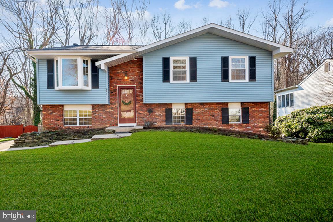 REVAMPED & REIMAGINED BROADNECK TRADITIONAL in peaceful WOODED SURROUNDS MINUTES FROM METRO AMENITIES!  Picnic on your treetop alfresco dining deck or lower shady patio spilling into the tree bordered, privacy fenced yard!  Lounge and lunch in the glass encased Florida Room through the vibrant, ever-changing seasons.  Appreciate the turnkey decorator neutral interiors with glossy wood flooring & quality carpeting to enhance any décor.  Detailing includes recessed lighting, custom built-ins, abundant windows, renovated Baths, ceiling fan breezes, and ample storage options.  The main level features an open concept floor plan with free-flowing bay window bump-out Living Room, Dining Room opening to deck, stainless Kitchen w/dining bar, Primary BR/BA, and 2 additional BRs/Full Family Bath.  The beautifully finished lower level offers a patio access Family Room with FP, Home Office, Bonus Room, Full Bath, Laundry, & storage.  Flexible living spaces to adapt and expand!  Multi-vehicle driveway.  Minutes from Historic Annapolis, premier shopping malls, AA Comm. College, golf, parks, and the Chesapeake Bay via RTs 2/50/97.  AWAITING YOUR UNIQUE TOUCHES and FLAIR!