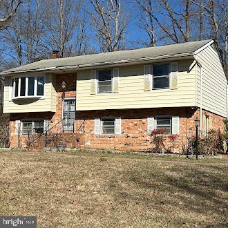 Great Investment Opportunity! This split-foyer home, situated on a spacious corner lot, offers incredible potential. Featuring 4 bedrooms and 2.5 bathrooms, this home boasts an efficient layout, a wood-burning fireplace, and both a deck and patio for outdoor enjoyment. The large basement includes a laundry area and ample storage space.  With two off-street driveways, parking is never an issue. Conveniently located near I-95, shopping, and dining, this property is perfect for investors or buyers looking to add their own personal touches. Don’t miss out on this fantastic opportunity—schedule your showing today!