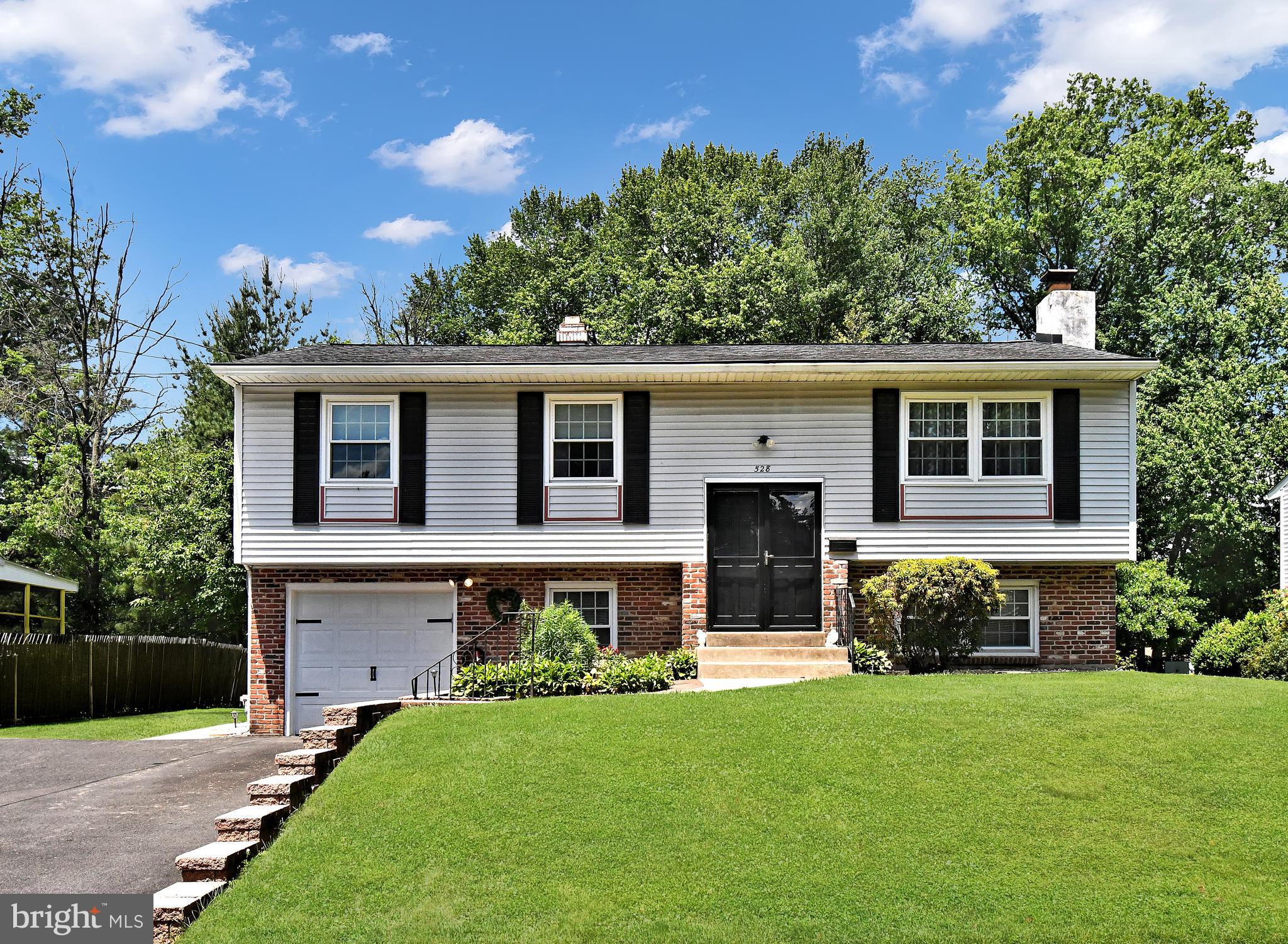 Welcome home to this beautifully updated 4-bedroom, 2.5-bath single home located in a wonderful neighborhood with a park-like setting ! This spacious home combines modern upgrades with comfortable living areas and plenty of room to spread out. The stunning brand-new kitchen features quartz countertops, new stainless steel appliances, new flooring, and abundant cabinet space — perfect for everyday living and entertaining alike. The bright and spacious living room flows into the formal dining room, creating an ideal layout for gatherings and holidays. The lower level has an oversized family room that offers endless possibilities with a cozy fireplace and direct access to the large, enclosed rear patio — a great space to relax, entertain, or enjoy the backyard views. The primary bedroom includes its own private half bath, while all four bedrooms offer comfortable space and great closet storage. Additional features include central air, a separate laundry area, an attached garage,  and a large backyard with plenty of room for outdoor enjoyment. Major updates include roof & gutters (2020), windows (2021), water heater (2023), brand-new kitchen (2026),  and Garage door and driveway 2025, offering peace of mind for years to come. Conveniently located in a desirable neighborhood close to shopping, dining, parks, and major routes. Move right in and enjoy the perfect blend of space, updates, and location!