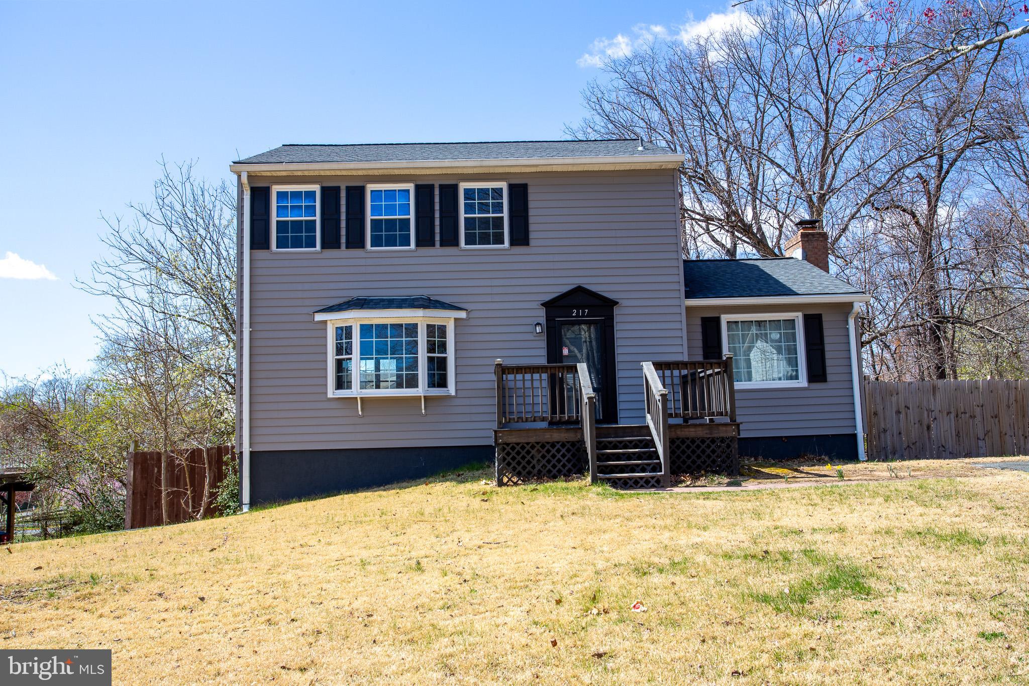 Welcome to this beautifully renovated colonial home in an excellent North Stafford location.   The open concept design connects the living room and kitchen, creating a spacious and inviting atmosphere for everyday living and entertaining. The kitchen was completely updated in 2022, featuring brand-new appliances, quartz countertops, stylish shaker cabinets, and an abundance of cabinet and counter space. You'll also find a charming reading nook.  Recessed lighting illuminates the main level.  A  wood-burning fireplace and sliding glass doors that lead to a deck, providing a cozy spot to relax and unwind. Newer luxury vinyl plank flooring graces both the main and lower levels.  All bathrooms received a modern makeover in 2023, boasting sleek quartz counters that add a touch of luxury to these essential spaces. The lower level of this home offers a rec-room that provides ample space for entertainment, while two comfortable bedrooms are perfect for accommodating guests, or serving as a home office or exercise room. The large, fully fenced backyard offers a private oasis for outdoor activities, gardening, and entertainment. This home is conveniently situated near parks, shopping, and entertainment, ensuring you have access to all the amenities you need. With proximity to Quantico Marine Corps Base, this location is ideal for military personnel and offers an easy commute. No HOA provides additional freedom and flexibility. Don't miss your chance to make this exceptional property your new home!