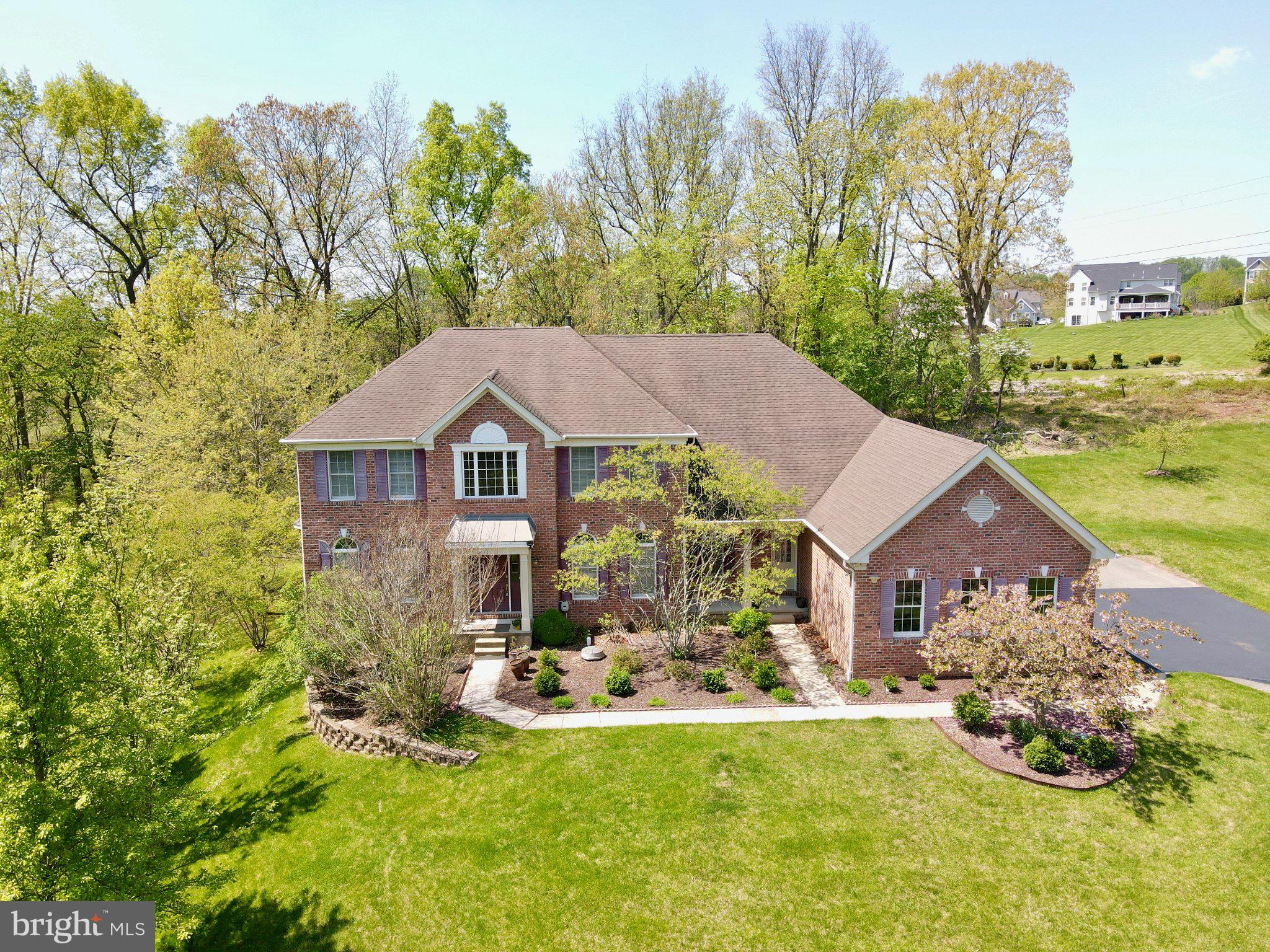 Welcome to 1464 W Stonington, an exceptional 4-bedroom, 5.5-bath single-family home located in the prestigious Reserve at Chestnut Ridge neighborhood, within the award-winning Downingtown School District. Set on a picturesque .73-acre lot, this stunning residence offers an impressive blend of elegant design, thoughtful upgrades, and luxurious living spaces. Some of the many thoughtful upgrades include premium hardwood floors, fresh paint, a tankless water heater, a Tesla charger, gutter guards, and a brand new HVAC installed in 2026. Step inside the two-story foyer, where a grand staircase sets the tone for the refined interior. The main level features a formal living room, a cozy family room with a fireplace, a private office, and a convenient powder room. At the heart of the home is the gorgeous eat-in kitchen, complete with new stainless steel appliances, gas cooking, and ample cabinetry—perfect for both everyday living and entertaining. The eat-in kitchen has direct access to the expansive back deck, refinished in 2018, seamlessly blending indoor and outdoor living. Upstairs, the spacious primary suite offers a true retreat, highlighted by an ensuite bathroom with a tub and dual vanities and sitting room or office. Three additional bedrooms complete the upper level, each featuring its own private ensuite bathroom, providing comfort and privacy for family and guests alike. The lower level boasts a beautifully finished basement with endless possibilities. With a full bathroom and a full kitchen, this space is ideal for an in-law suite, extended living, or recreation. Outside, enjoy peaceful views from the large AZEK deck and patios overlooking your private, expansive backyard—perfect for relaxing or entertaining. The sides and rear of the home are covered in upgraded Hardie Plank as well. Located in West Bradford Township, this home offers serene surroundings while remaining conveniently close to shopping, dining, parks, and public transportation. A rare opportunity to own a truly special home in one of the area’s most sought-after communities. Schedule your showing today!