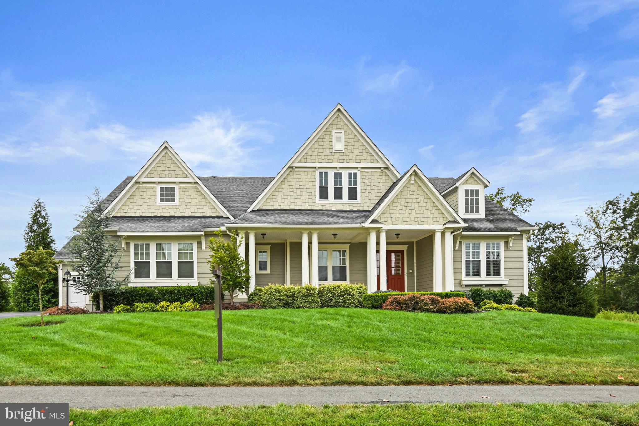 A home built to embrace your life today and every chapter ahead!

Purposefully designed by Drees Homes, 25801 Yellow Birch Court is the perfect blend of refined elegance and everyday functionality. Located on a quiet cul-de-sac street in Willowsford Greens, this 5-bedroom, 5-full bathroom, and 2-half bathroom home offers over 5,300 square feet of thoughtfully crafted space ideal for multigenerational living, entertaining, and effortless comfort. With community common space to the right, you will enjoy added privacy and peaceful green views that bring nature to your doorstep.

At the heart of the home, the open-concept kitchen, family room, and breakfast area are made for connection. A wall of windows in the family room frames the lush backyard while a fireplace creates a cozy focal point. Step directly out to the three-season screened porch with its own fireplace where indoor-outdoor entertaining flows naturally, perfect for quiet mornings or lively evenings.

The gourmet kitchen includes granite countertops, stainless steel appliances, gas cooktop, butler’s pantry, and a spacious island. Whether hosting a dinner party in the formal dining room or enjoying everyday moments in the breakfast nook, this home makes it feel effortless.

The main level offers three bedrooms, three full bathrooms, and a powder room, including a spacious primary suite with a sitting area that could easily serve as a walk-in closet, spa-like bath, and walk-in closet. A secondary en suite bedroom with custom built-ins is ideal for a home office, and a third bedroom with a nearby full bath offers even more flexibility.

Downstairs, the walkout lower level feels like its own private residence with two additional bedrooms and two full bathrooms, a home gym, and a spacious recreation room featuring an electric fireplace and built-in entertainment bar. The expansive open space offers plenty of room for a media room, game area, or private quarters for long-term guests or an au pair.

Outdoor living continues with an open-air deck, covered patio, fully fenced backyard, and an irrigation system. A split three-car garage, custom mudroom, and Shenandoah Plantation Shutters add function to the beauty.

Elegant yet livable and designed with purpose and warmth, this is a home ready to grow with you.