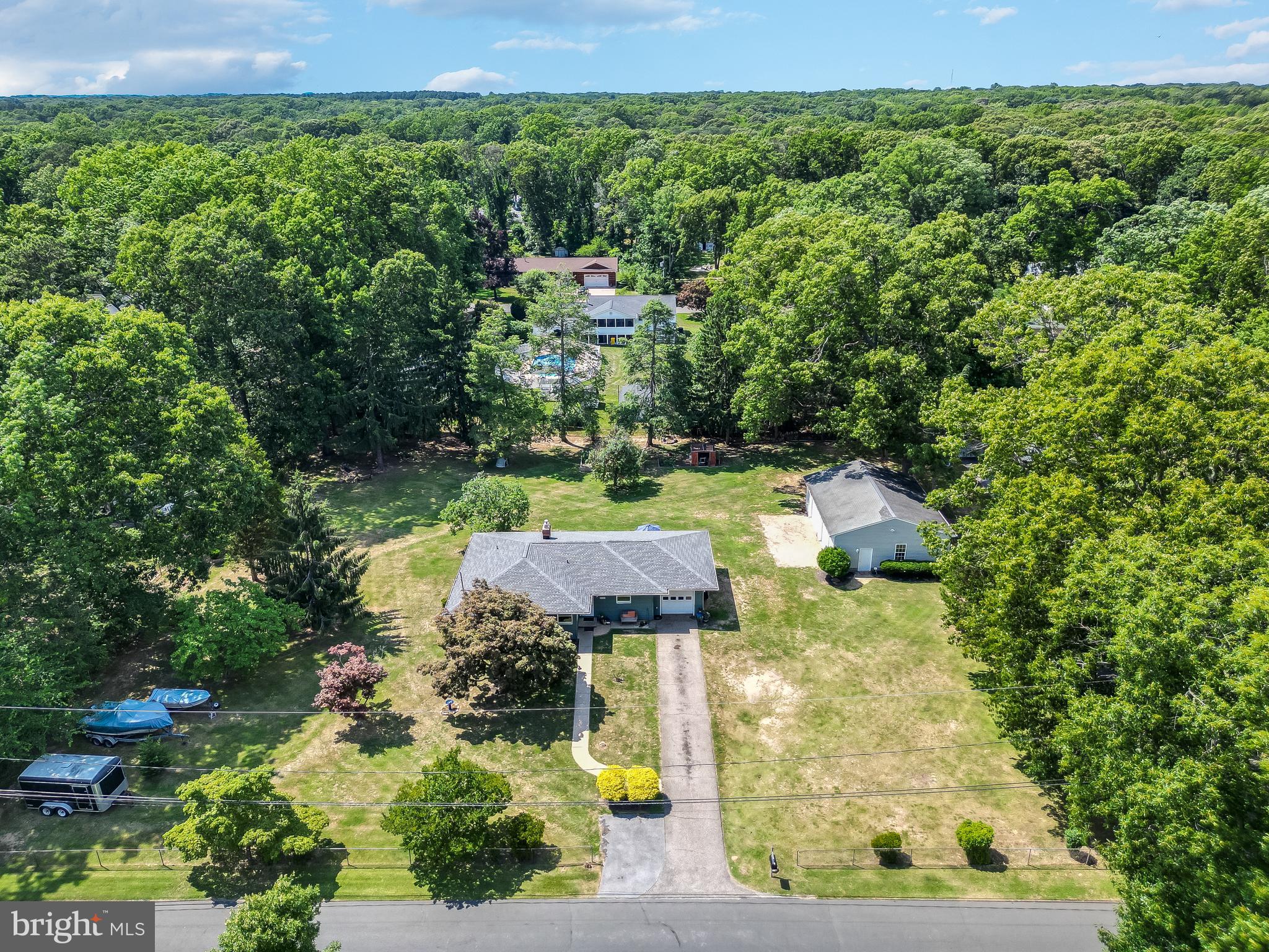 AMAZING 1 ACRE PROPERTY WITH ATTACHED GARAGE AND 30'X40' DETACHED GARAGE with 12' CEILING.  200 amp service in Garage and in House   AMAZING YARD WITH SERENE SETTING

Serene setting for this amazing OVERSIZED 1200 sq ft L shaped Rancher!  New Vinyl Shake Shingle Siding and Architectural Roof.  Unique floor plan features Family Room on back of home with fireplace and large Picture Window overlooking beautiful backyard and gardens.  Large Bedrooms, oversized Bathroom features separate tub and shower on main level, hallway spacious hallways and hardwood floors on entire main level.

Lower Level is Fully Finished with Wet Bar just waiting for you to enjoy.  Bonus Finished room in basement could be used for Play Room, Home Office, Craft room...and more!  Basement also features a full bath!  Yard measures