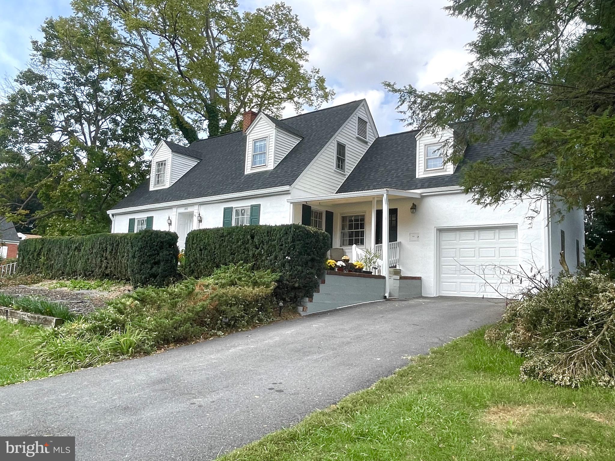 What an opportunity to own this exquisite 1948 Cape Cod on the highly sought after West End of King Street in Martinsburg.  This beauty is situated on a .44 acre corner lot. She has 3 year old roof, gutters with leaf guards, and recently had a complete exterior facelift.  This home is full of unique, quirky features you will only find in a Vintage home.  The kitchen has original built in cabinets, 36 in range, the original cast iron sink with drainboards, and brand new white quartz countertops.  Your mail is delivered into the home's built in mailbox. The main level and upper level hallways have metal doors for the laundry chute, and the built in cabinet in the basement laundry area, catches it! The stairway has an original metal and wood chair lift which is operated by a motorized winch in the basement.  Very cool. If you have no mobility issues, just use it for your laundry basket or vacuum cleaner! This home has lots of small and large storage areas within the entire home, with clothing closets lined with cedar.  This home is complete with  a dual zoned heat and air conditioning. Also still installed is the hot water baseboard boiler, which could be updated and returned to function as a back up heat.  All rooms are large, full of light, and freshly painted. The living room opens to a large screened porch. The living room also has a spiral staircase that leads down to the finished recreational room.   No remarks in this listing can describe how wonderful this home is.  Make your appointment to see it for yourself and start making your own memories in a home of yesteryear! It won't disappoint!