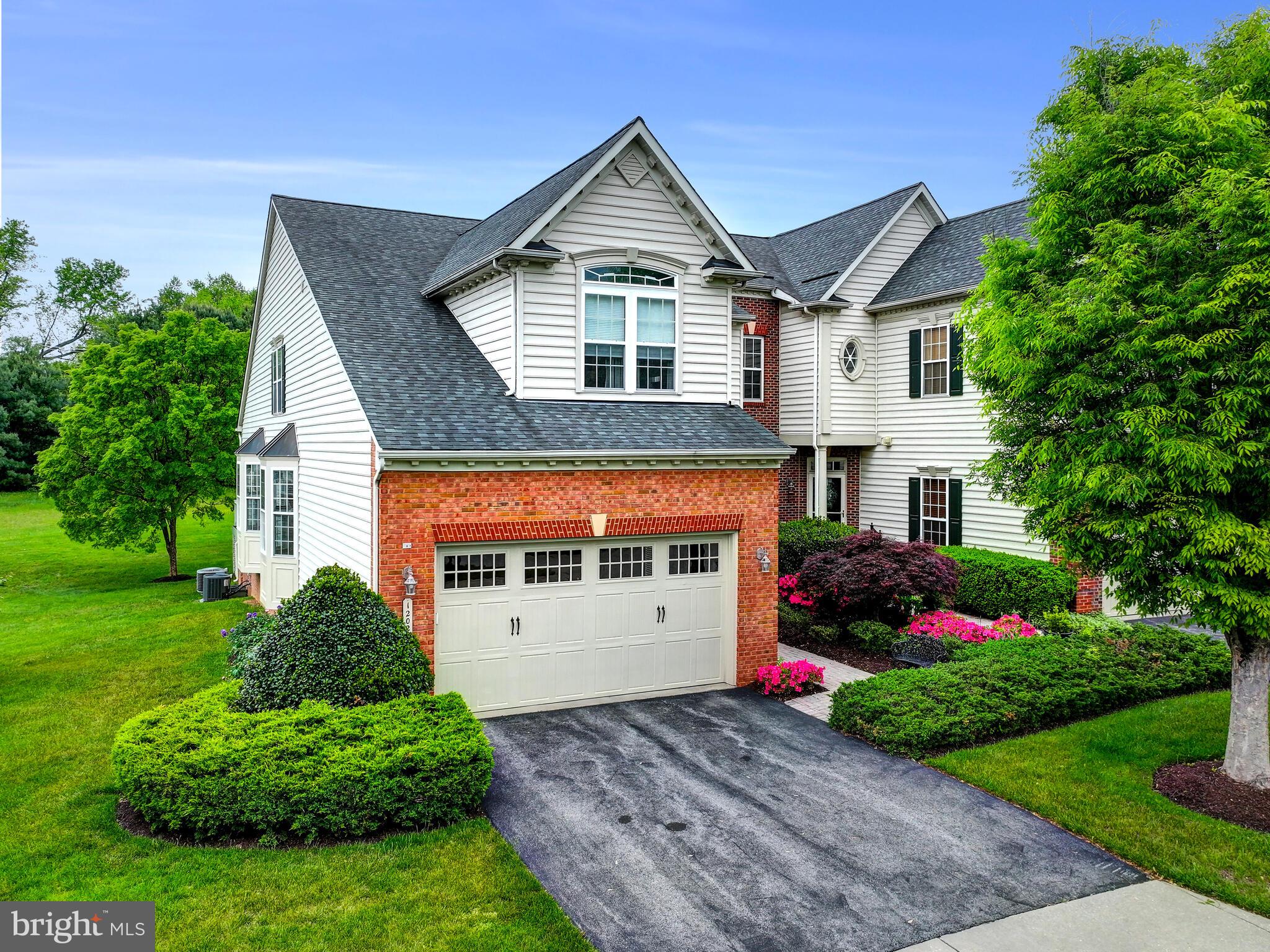 Coming Soon in Sought After Ellicott Meadows!  This first-time available End Unit, three level Townhouse, has been impeccably maintained from top to bottom.  The masterfully landscaped property provides an explosion of spring perennials.  You will be delighted every week with the new vibrant colors of the staggered plantings.  The entrance Foyer is flooded with morning sunlight through the lovely glass front door.  The main living level offers a well-appointed Kitchen with rich wood cabinetry including some with glass front doors to display your special treasures.  Neutral tone solid surface countertops, quality rated stainless-steel appliances and a substantial center island with additional closed cabinet space grace this heart of the home.  An extended dining area, surrounded by windows, is a delightful spot to get your day started.  This room opens to the massive Great Room with a two story vaulted ceiling.  The wood floors continue through this sun-filled area as it is surrounded by oversized windows and an extended, carpeted Sunroom that features two walls of windows.  Sliding doors take you out to private deck that is perfect for alfresco dining.  As expected in a Senior Living Community for 55 and better, there is a Main Level Primary Suite.  The extraordinary Bedroom is tastefully decorated with a feature wall, tray ceiling and dramatic window draperies with cornice.  There is also a substantial walk-in closet and full bath with a walk-in shower and built-in seat.  The main floor includes a Powder Room off the Foyer, a Laundry/Mud Room off the Kitchen and a glass double-door entry to the Library or, depending on your needs, a potential fourth Bedroom.  Ascend to the second level to find the pleasant open loft which is a multi-purpose bonus.  This area overlooks the Great Room and is sun-filled throughout the day.  Two generously sized Bedrooms share a full Bath.  There are an additional two walk-in closets and an insulated, unfinished utility/storage room on this level while each Bedroom has its own generous closet space.  Head to the Lower Level and discover a "Party-Sized" Family Room that includes a moveable two-piece bar and plenty natural light from multiple windows, another full Bath and unfinished Storage Room which includes a moveable work bench.  Community amenities include an artfully decorated Club House for parties, cards or weekly exercise classes, an In-Ground Pool and Pickle Ball and Tennis Courts; all included in the monthly HOA Dues.  The Community HOA and Condo Resale documents are available upon request. There are countless restaurants of International cuisine nearby.  Easy access to Routes 40, 70 and 29 can have you in Baltimore, Frederick and Washington in no time at all.  Come see for yourself and make this special offering your next home! This one will not last long!
