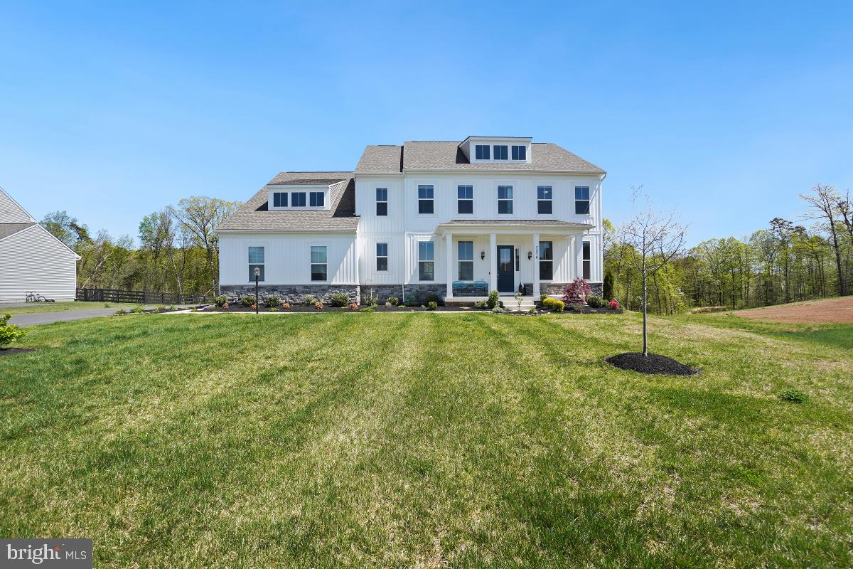 Over $150K in upgrades! Welcome to this incredible home sited on a 1/2 acre premium lot backing to trees and open space! The views and privacy are amazing! The tremendous exterior living space has been upgraded with a huge patio, built-in firepit with seating and a large covered composite deck, ambient lighting & custom ceiling fan. Sit and soak up the outdoors in your own private oasis! The interior of this home is stunning with high ceilings and walls of windows flooding the living spaces with natural light. Luxury vinyl plank flooring is featured throughout most of the main level for low maintenance in addition to recessed lighting galore and custom built-ins! Upon entering, you are greeted with a Flex space to the right, perfect for a playroom or living room with built-in cabinetry and lighting along with a formal Dining Room to the left with an accent wall and room for an extended dining table for all your family gatherings! The Family Room extends off the entryway with a wall of windows peering out to the backyard, recessed lighting and a warm  linear gas fireplace as well as floating shelves! A gourmet dream Kitchen flows off the family room featuring an oversized, Quartz top, center island with storage cabinets, quartz countertops, upgraded white cabinetry as well as an impressive walk-in Pantry! A huge Breakfast Area extends off the kitchen with views of the backyard and provides access to the covered deck area! Rounding out this level is the Main Level Bedroom, expansive in size, along with a private ensuite Main Level Bathroom ready for in-law's or an au pair! In addition, a convenient powder room and large closet as well as a mud room complete this phenomenal level! Leading to the upper level is a beautiful wood staircase to the upper level Retreat Area, perfect for a lounge space or homework station! The expansive Primary Suite boasts a large Sitting Room and an incredible Ensuite Bathroom with two separate vanities with tons of storage and counter top space, upgraded lighting, ceramic tile flooring, a private water closet as well as a huge walk-in shower with frameless glass and tile surround! Completing the primary suite is the unbelievable walk-in closet that provides endless storage options! Three additional bedrooms can be found on the upper level that are generous in size and all have walk-in closets along with two additional full bathrooms and a laundry room with utility sink and storage! The endless possibilities continue to the lower level with an additional 2,500 sqft of unfinished space to customize as you see fit! Plenty of space for multiple rooms, rough in plumbing for a full bathroom as well as a double door areaway providing access to the backyard's oasis.  To top it off, this property features a solar panel that is paid for so the new owner can move in and instantly start saving on utilities! The Woodborne Preserve community is a quiet community of just under 60 home sites conveniently located to major shopping, grocery and transportation, not to mention zoned to an excellent school pyramid! This property is truly magnificent!