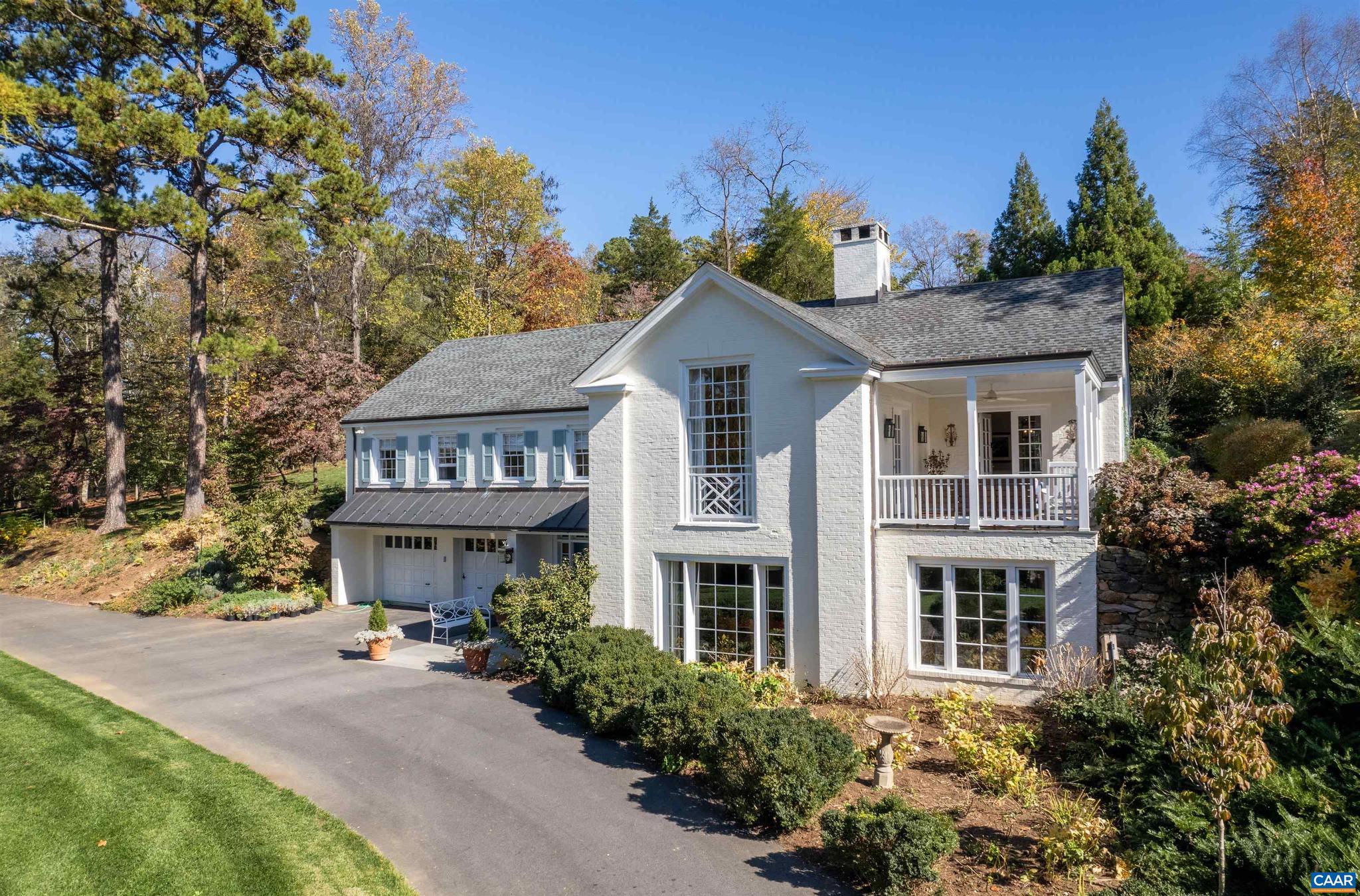 Beautifully renovated home in Bellair. Dining room opens directly onto a covered porch, perfect for seamless indoor-outdoor dining and entertaining. Living room captivates with a vaulted ceiling, custom floor-to-ceiling bookcases, and lots of natural light. The terrace level features a spacious rec/family room and a dedicated exercise room, ideal for fitness and relaxation. The property also includes a two-car garage, providing ample space for vehicles and storage. Outside, the owner has meticulously landscaped the grounds, planting 50 trees and over 1,000 perennials that flourish under an efficient irrigation system. Conveniently located near Boars Head, UVA and easy access to downtown.,White Cabinets,Fireplace in Living Room,Fireplace in Rec Room