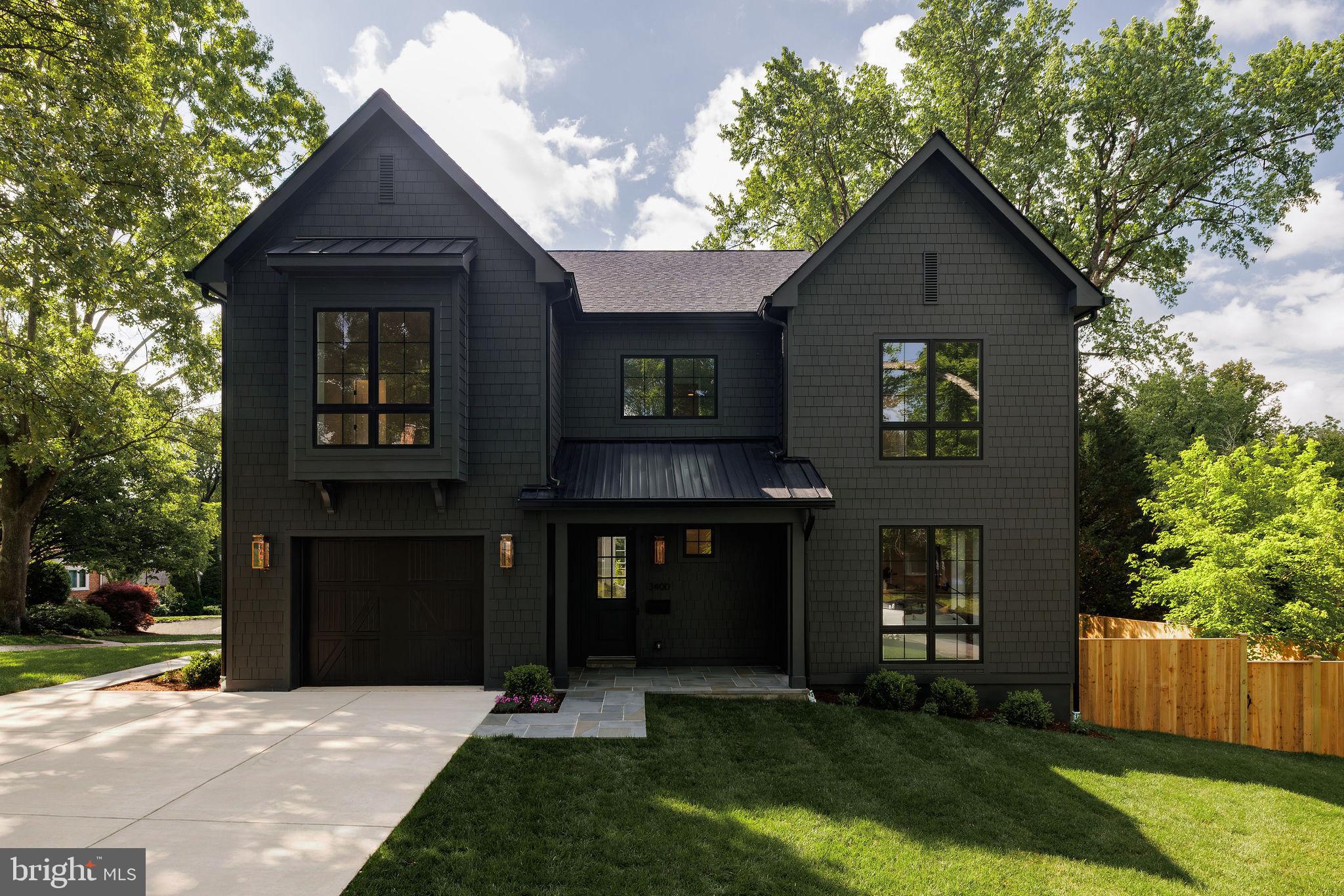 Thoughtfully designed and beautifully finished, this newly constructed residence by Urban Restoration, offers a rare blend of craftsmanship, scale, and modern livability on a large fenced lot in Chevy Chase. Ideally positioned at 3400 Coquelin Terrace, the home combines a quiet residential setting with convenient access to neighborhood parks, retail, and commuter routes.

From the moment you arrive, the home’s striking curb appeal is defined by its refined exterior palette, copper gas lanterns, and inviting covered front porch. Inside, rich sand-and-stain-in-place hardwood flooring and solid core doors set the tone for quality throughout. The main level is anchored by a chef’s kitchen designed for both everyday living and entertaining, featuring custom inset two-tone cabinetry, an oversized island, dual dishwashers, a 60" refrigerator/freezer, a 48" dual fuel range, a separate wall oven and built-in microwave, and a dedicated wine fridge, along with dual sinks. The kitchen flows seamlessly into expansive living and dining spaces, creating an effortless and open layout. A large private office with an architectural beamed ceiling and a generously sized mudroom add both character and everyday functionality to the main level.

Upstairs, four well-proportioned bedrooms and three full bathrooms include a spacious primary suite with custom closets and a timeless elegant marble tile bath featuring a large walk-in shower and separate soaking tub. A large, thoughtfully designed laundry room is conveniently located on the upper level, enhancing everyday ease and livability.

The lower level adds exceptional flexibility with a fully finished recreation space, a wet bar, an additional bedroom, and a full bathroom. Walk-out stairs provide direct exterior access, making the space ideal for guests, extended stays, or additional entertaining.

Additional highlights include a generously sized garage with expanded storage capacity, along with an oversized driveway comfortably accommodating multiple vehicles. Tucked away on a quiet dead-end street with no through traffic, the setting offers a rare sense of privacy and tranquility, where only residents and their guests pass through.

Extensive built-ins, custom closet systems, a fireplace, and a high-performance mechanical system with ERV and steam humidifier further elevate the home. Every detail has been carefully considered, delivering a residence with truly magazine-worthy finishes and enduring quality throughout.