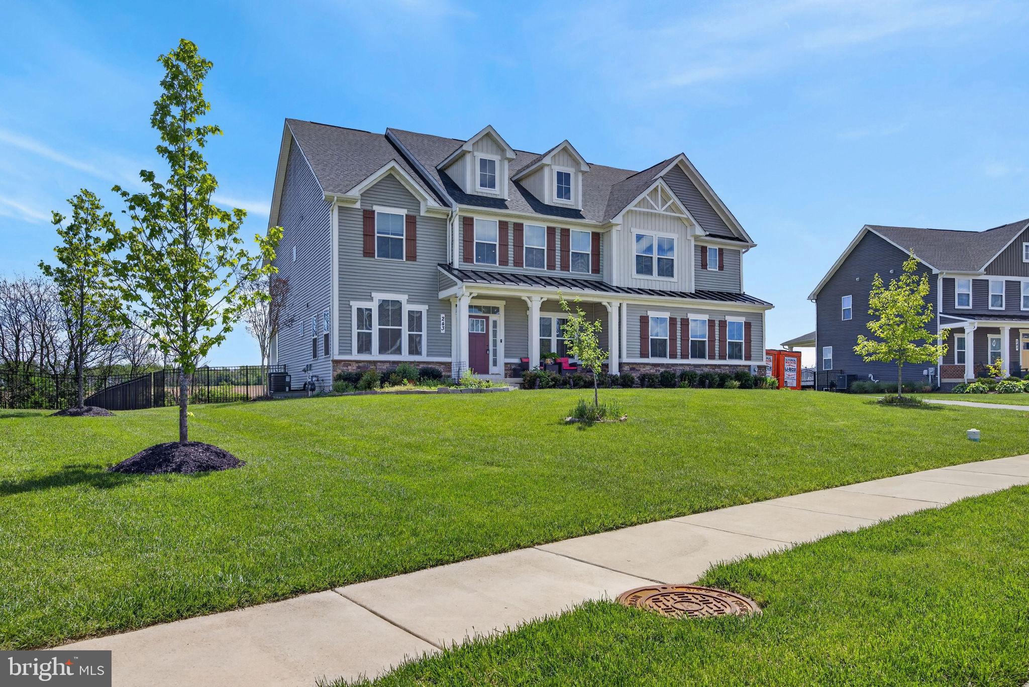 This beautiful Versailles model offers a spacious and flexible floor plan designed for both comfort and style. The home features upgraded flooring and stairs throughout, along with a stunning wall of windows that fills the living room with natural light. The gourmet kitchen is the heart of the home, complete with a large center island, abundant cabinetry, and an open layout ideal for entertaining.

The main level includes a convenient primary bedroom suite, while a mudroom leads to the spacious side-entry garage. Upstairs, a huge loft-style living area overlooks the main living space, providing the perfect setting for an additional family room, entertainment area, or home office. The owner’s suite is truly stunning, offering generous space and comfort. An upstairs laundry room adds everyday convenience.

The walk-up unfinished basement offers endless possibilities for future expansion. Outside, enjoy an oversized custom patio backing to peaceful green farmland, creating a private and relaxing outdoor retreat.

Located just minutes from downtown Frederick, the home offers convenient access to shops, restaurants, entertainment, parks, and commuter routes while still enjoying a quiet and scenic setting