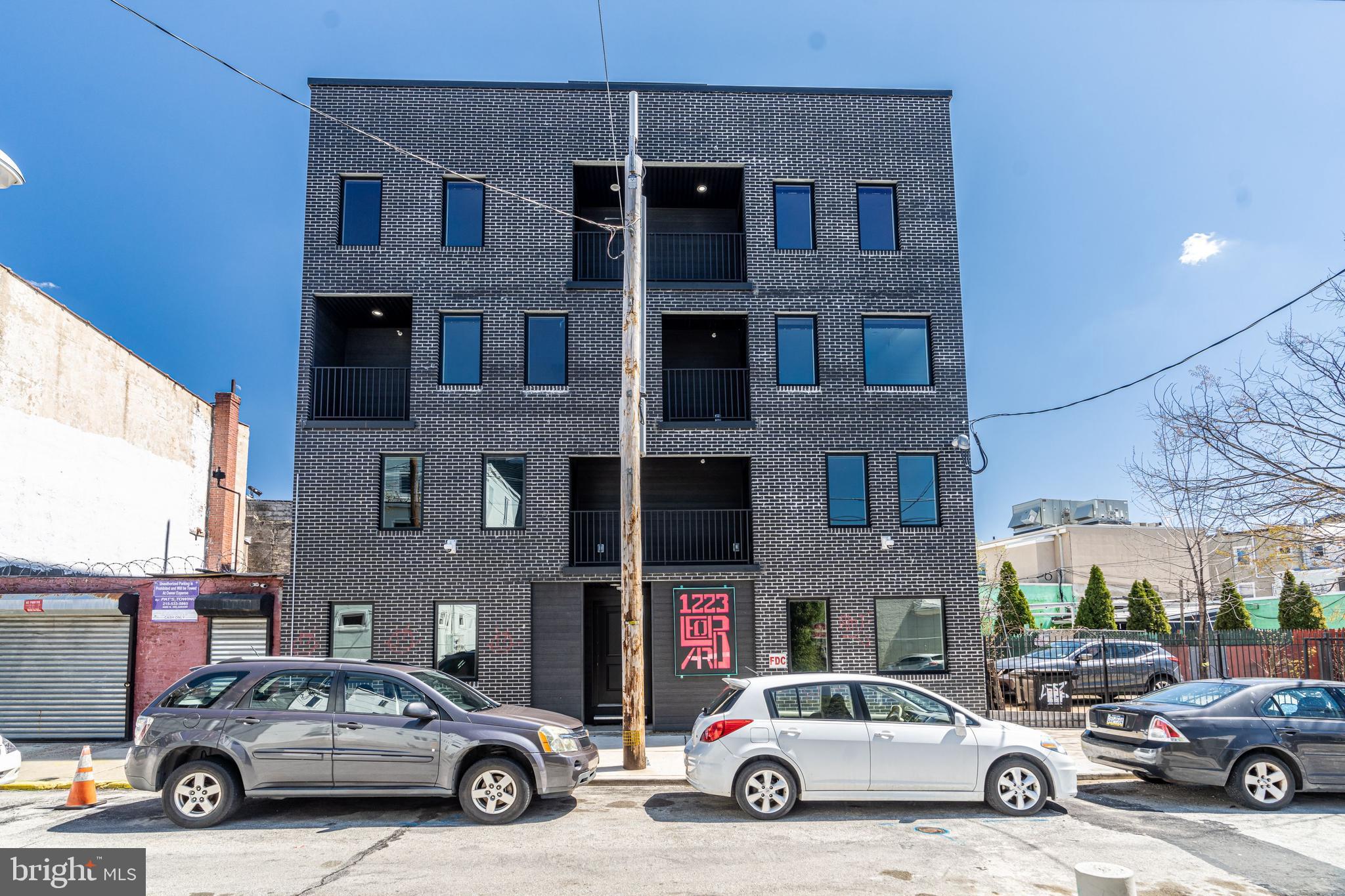 Amazing opportunity to own a SIX unit brick apartment building with massive roof deck in a prime Fishtown location!  This stylish new construction building was completed in spring of 2022 and is just a half a block from bustling Frankford Ave and the El (subway), the location can’t be beat.  Annual rent roll for 2024 was $177,000.  Incredibly low taxes $2,239/yr!  Full tax abatement  until April 2032.    Two (2) ground floor units are bi-level and include 2 bedrooms, 2 full bathrooms, and large private yards.  Two (2) second floor units include 1 bedroom, 1 bathroom, and shared balconies.  Two (2) third floor units are bi-level and include 2 bedrooms with shared balconies, 2 en-suite bathrooms, 1 half bathroom and private balconies on the main living level.  In addition to the private yards and balconies offered with each unit, all units share a large 1500+ sqft common roof deck with panoramic views of the city skyline.  Black sound transmission class Pella windows with built-in blinds between the glass, spray foam insulation throughout, PEX plumbing manifold, fiberglass roof, security surveillance system, custom steel security gate and bike room gate, recessed LED lighting, matte black hardware and fixtures…  Large kitchens include gas cooking, stainless appliances, quartz counters, and tiled backsplash.  Water and scratch resistant luxury vinyl wood flooring throughout, the perfect long lasting flooring choice for durability with tenants and pets. Tile flooring in lower level.  All units include washer/dryers, double sink vanities, great closet space, and stylish finishes throughout.  Each unit having outdoor space is a rare find in apartment buildings and added bonus!   Large irregular lot, approximately 40' wide and 56' deep, allows for spacious units and outdoor living spaces.   Steps away from public transportation, restaurants, coffee shops, gyms, galleries, parks, vibrant nightlife, and everything else that Fishtown offers!  Fully occupied, must give tenants 24hrs+ for any showings.  Builder and listing agent present for all showings.
