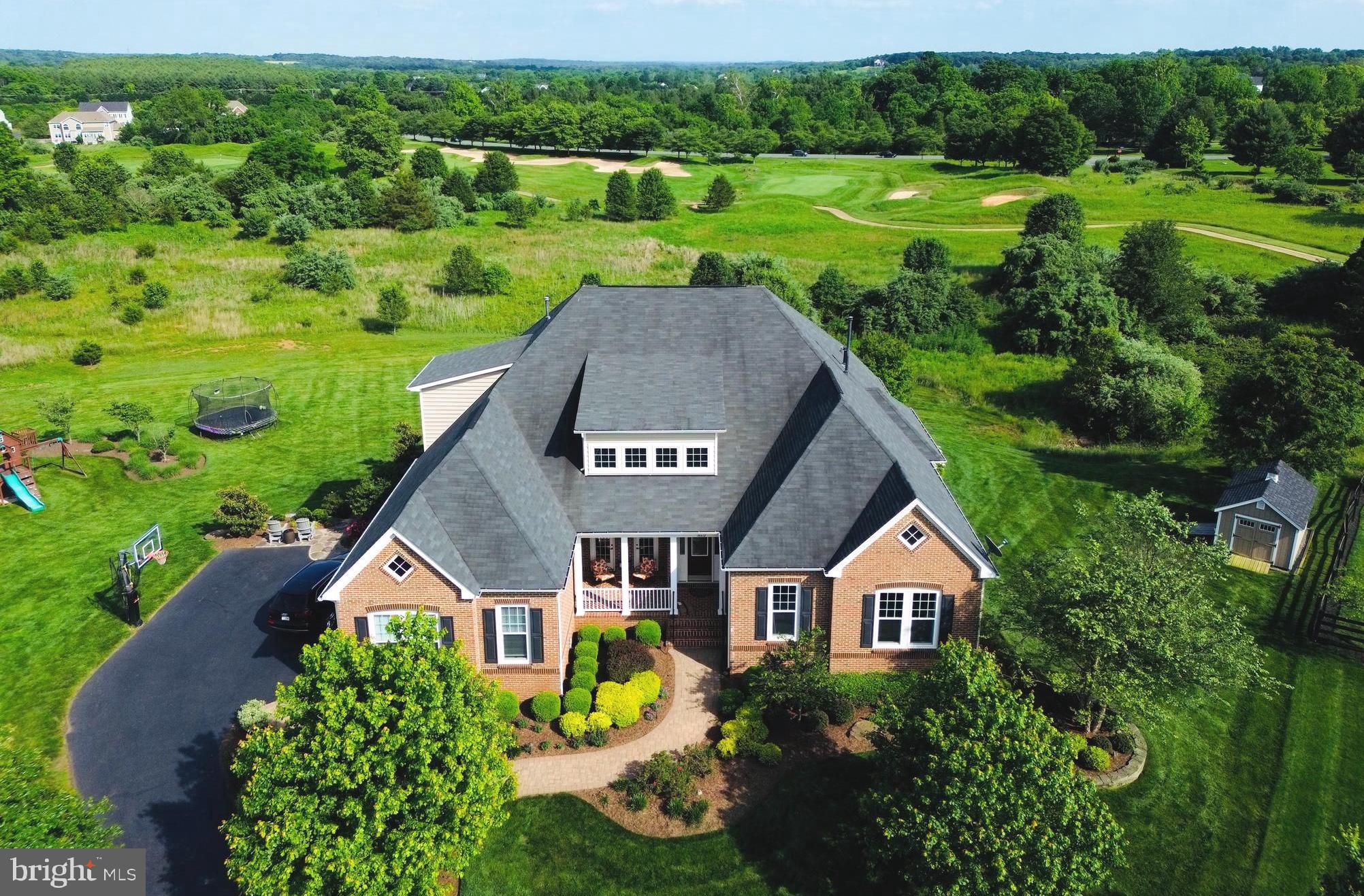 Come tour this beautifully-designed home Saturday June 8 from 1-3PM at the open house.   This is the home that you've been searching for...   For the discerning home buyers who are searching for a home that goes far beyond the ordinary, this is your home.   Tucked and the end of a quiet cul-de-sac overlooking acres of open space and the Gary Player designed Raspberry Falls Golf and Hunt Club, this lot is one of the best lots in the entire community; the panoramic views are simply unmatched.  

Over $400K has been invested in improvements by the original owners, including a car-lover's dream garage with two hydraulic lifts (allowing 5 cars to be stored inside), custom built-in storage system, epoxy floor and improved lighting.   

One of the most sought-after models here in Raspberry Falls, the Northridge is a modern version of the cape cod style home that offers 10' ceilings across the main level, double tray ceilings soaring to 12' in the family room and in the main-level primary bedroom.    The gourmet kitchen offers endless cabinetry, a large breakfast area surrounded by windows and is open to the family room with cozy fireplace with soaring boxed ceilings.  The primary bedroom offers matching boxed ceilings, separate walk-in closets with custom organizer systems, plus an en-suite primary bathroom offering a spa-like experience with separate vanities, large soaking tub with separate oversized shower

The lower-level is beyond description and simply must be experienced in person; it is a truly jaw-dropping.  The owners have created a remarkable lower level that will be the envy of everyone who visits.  A custom bar with reclaimed wood paneling, a wine-cellar, an open media room, a home gym, two bedrooms, (or use one room as a second home office), plus an entirely separate craft room with an amazing center island workspace.    This walkout lower level leads to the rear patio with stone knee wall, a covered patio below the deck and an expansive rear yard.

The upper level offers two generously-sized bedrooms, an additional full bathroom plus a separate sitting area, homework area or kids hangout area.

The outdoor space was thoughtfully crafted to take advantage of the gorgeous and panoramic views of community open space and the golf course beyond.  A covered porch with fireplace, cathedral ceilings, uncovered deck with stairs leading down to the covered patio offers incredible outdoor entertaining and alfresco dining options.   

Located 10 minutes from the center of historic downtown Leesburg with its restaurant and brewery scene, this location offers incredible convenience and sits at the gateway to western Loudoun County, with numerous award-winning breweries, wineries, parks, recreational farming venues, Potomac River access, proximity to the W&OD trail plus the C&O Canal trail that runs along the Potomac River.  Call listing agent (and Raspberry Falls resident) Matt Elliott to schedule your private tour.
