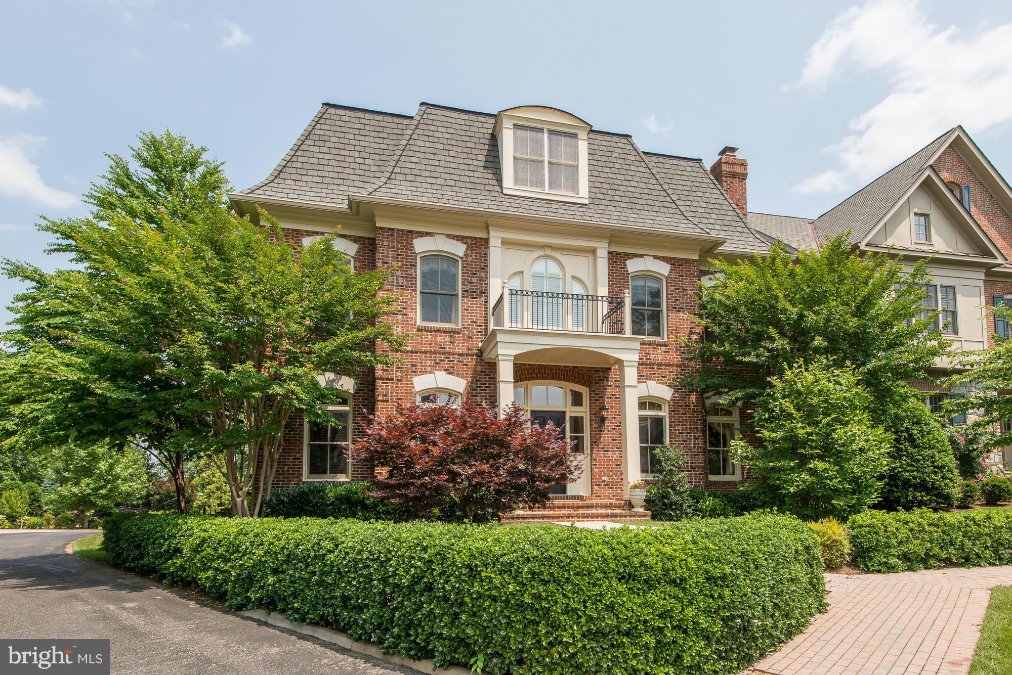 Wonderful 4-level residence in Evans Farm! This offers lovely public rooms, gourmet kitchen opening to large family room, luxurious master suite w/ sitting area, elevator to 3 levels.  Palladian windows, crown molding & hardwoods floors throughout. 3rd level features a perfect home office space & lower level provides a recreation room, billiards area w/ a large bar and more! Three-car Garage.
