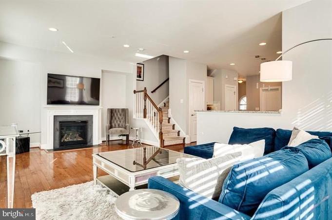 Beautiful Stanley Martin Brick End-Unit Townhome in the Heart of Fairfax City! This home boasts a gourmet kitchen featuring stainless steel appliances, granite countertops, a center island, and pendant lighting. The main level offers a spacious Great Room with a gas fireplace Gourmet kitchen with large granite island and access to a private deck. The luxurious master suite includes a spa-like bath. The upper level features two additional bedrooms, each with access to a shared bathroom. The lower level offers a large recreation room that opens to a patio. A 2-car garage adds convenience. Ideally located close to shops and restaurants!