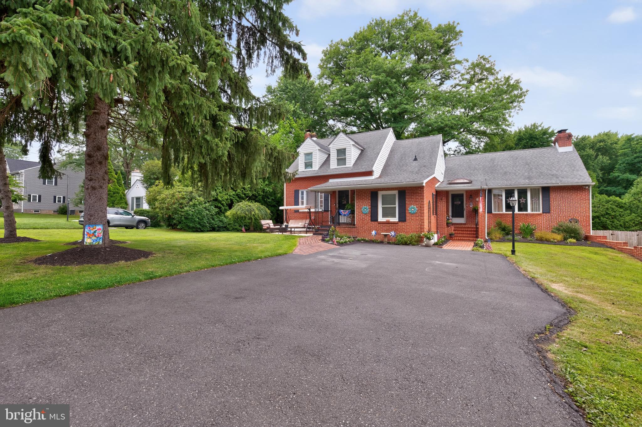 Welcome to 68 New Rd, a solid brick home tucked on nearly half an acre in Upper Southampton Township, Centennial School District. Four bedrooms, two full baths, and 2,355 square feet above grade, set on a private, tree-lined 100 x 200 lot with room to breathe.

Step inside and the main level greets you with a warm, open living space centered on a floor to ceiling brick wood-burning fireplace, rich hardwood floors, and crown molding throughout. The dining area flows right into an updated eat-in kitchen with gleaming granite counters, a large center island with seating for four, stainless steel appliances including a gas range, custom white cabinetry, and a designer tile backsplash. Whether you are hosting the holidays or grabbing coffee before work, this kitchen simply works. A full bath and a flexible bonus room round out the main floor, perfect as a home office, den, playroom, or fourth bedroom. Upstairs, a comfortable primary bedroom and two additional bedrooms with generous closets share a beautifully updated three-piece bath with a spa-style tile shower.

Now for the showstopper. The full walkout lower level was recently and completely refinished, transforming it into a stunning second living space you will actually use. Wide plank flooring, recessed lighting, a sliding barn door, a dedicated home office nook, and a separate laundry room with utility sink. Best of all, there is a full second kitchen down here with its own refrigerator, range, and generous cabinetry, plus a built-in bar area with butcher block counter. A French drain system was installed as part of the renovation, so this space is dry, comfortable, and built to last. With a private walkout entrance, a second kitchen, and room to spread out, this level opens up real possibilities: in-law or guest suite, multi-generational living, teen retreat, or the entertaining space you have always wanted.

Outside, the party continues. The covered rear patio with ceiling fan is made for summer dinners, and the expansive backyard delivers a stone fire pit ringed with seating, mature shade trees, a large barn-style shed with a covered wood store, raised garden beds, and a standalone greenhouse for the gardener in the family. There is genuine space out here, the kind that is getting harder to find.

The location seals it. The Newtown Rail Trail entrance sits a quarter block away, Veterans Field and playground sit at the end of the block, and you are minutes from shopping, dining, and the Turnpike for an effortless commute. Solid brick construction, central air, natural gas heat, and a freshly refinished lower level, all in one of Southampton's most connected pockets.

This one has been loved. Come see it for yourself.