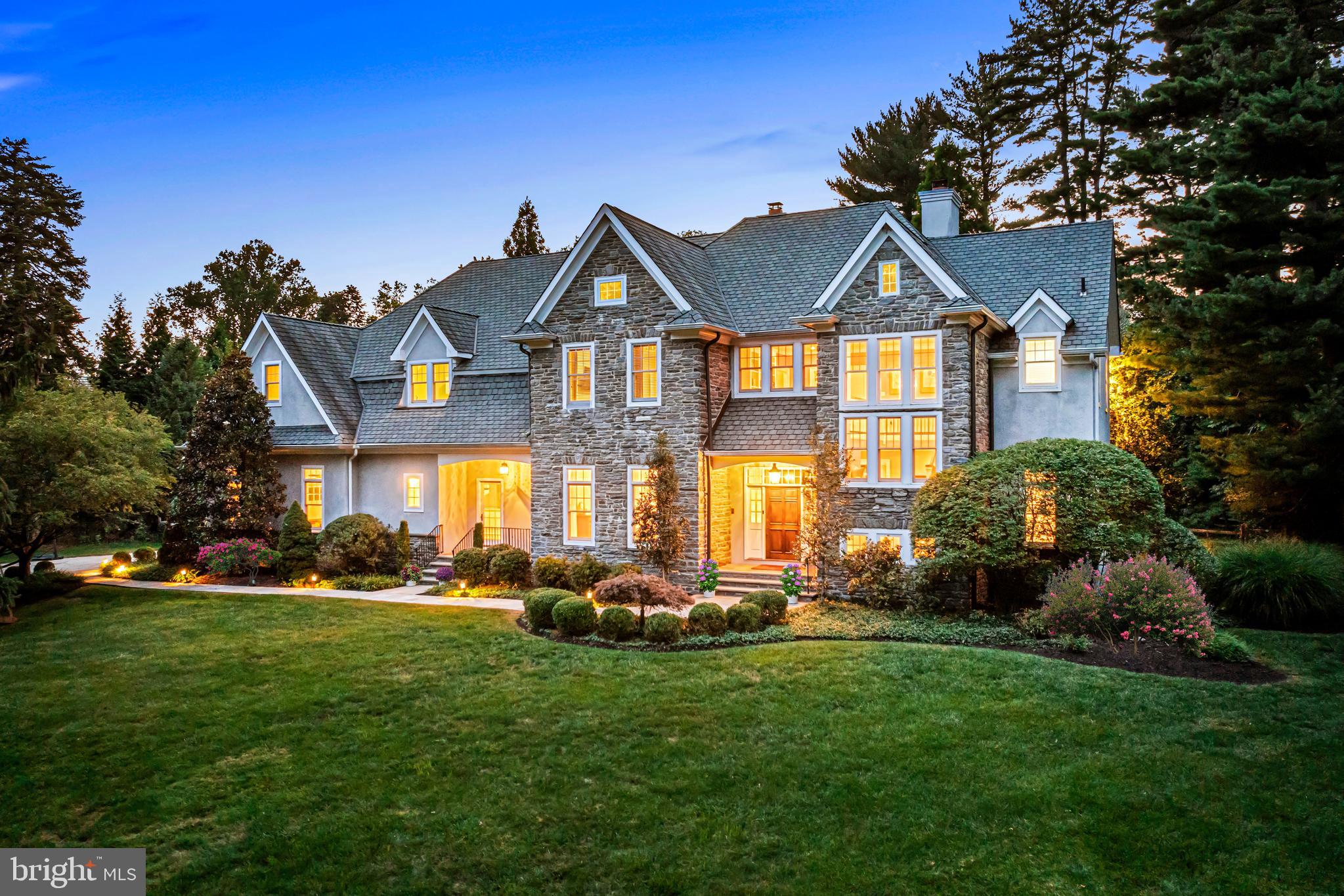 Welcome to this beautifully crafted, sun-filled Devon estate, perfectly sited on a private, flat 1.87 acre lot with spectacular landscaping, hardscaping and stunning pool. Built with superior materials, timeless designs, soaring ceiling heights, hand crafted moldings, gracious room sizes and a wonderful open flow, this masterpiece will sell quickly. Features include fabulous wide plank cherry floors, front to back views of the private grounds and pool, 10'ceilings with understated millwork detail, custom designed gourmet kitchen opening up to a family room with coffered ceiling detail and expansive exterior terraces, rich library with extensive custom built-ins, luxurious primary suite with wide plank floors, trayed ceiling, sitting room, his and hers marble baths and walk-in dressing rooms, 4 additional large bedrooms, two with custom-tiled en-suite bathrooms and two sharing a generous Jack and Jill bathroom, expansive finished lower level and more. Move right in and enjoy this coveted location in close proximity to renowned Tredyffrin-Easttown and endless private schools, fabulous restaurants and shopping, trains, Philadelphia International Airport and more. A real treasure!!