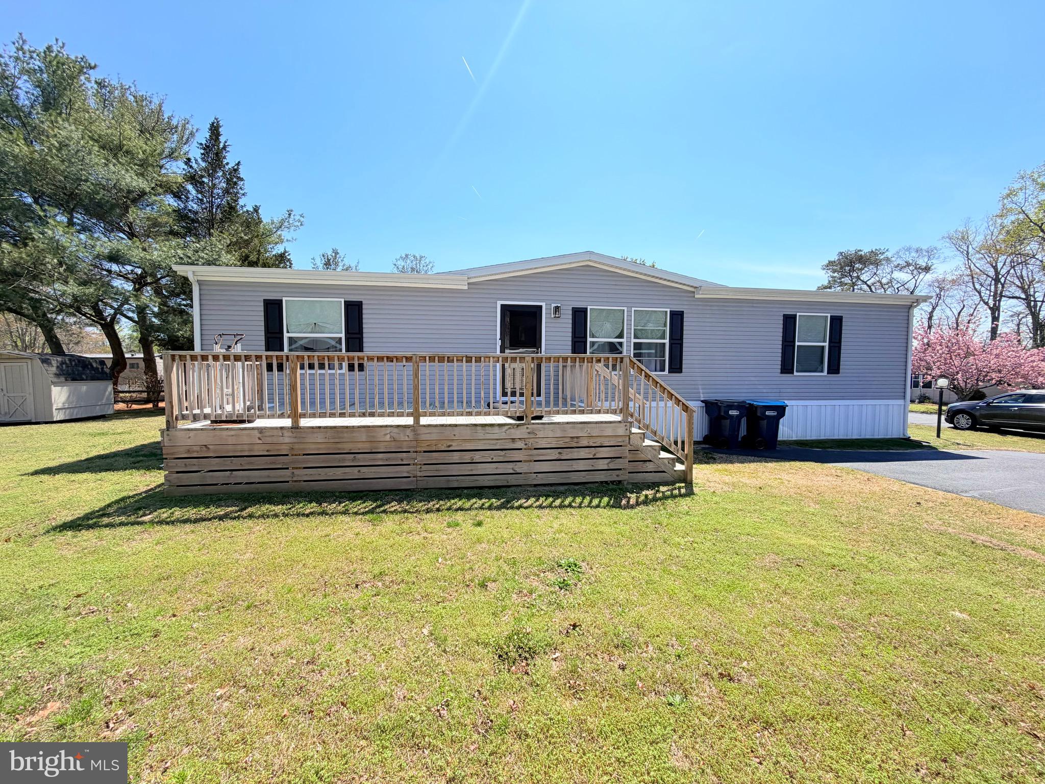 This charming and cozy three-year-old home offers easy, modern living in a well-designed 3-bedroom, 2-bath double wide. The open floor plan makes the space feel bright and welcoming, with the kitchen at the heart of the home. It opens seamlessly to both the breakfast area and living room, making it perfect for everyday living and casual entertaining.

The primary bedroom is thoughtfully located on one side of the home for added privacy and features two spacious closets along with its own private bathroom. On the opposite side, you’ll find two comfortable secondary bedrooms and a full bath they share.

Step outside and relax on the front porch /deck while enjoying morning sunrises or peaceful sunsets. This well-kept, nearly new home is move-in ready and waiting for you—schedule your tour today and come see it for yourself.