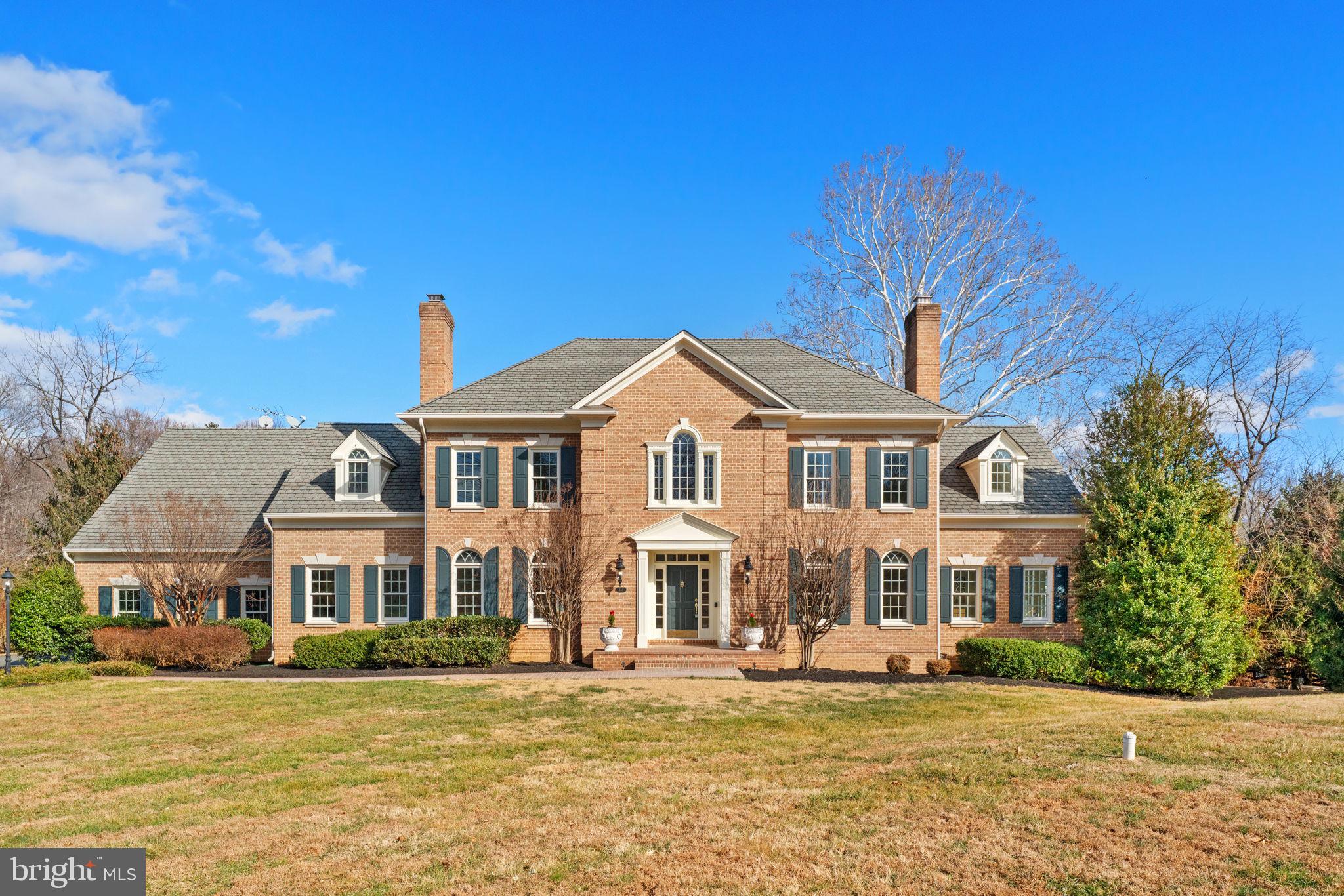 Stately Estate Residence on Over Two Acres in the Coveted Langley High School Pyramid
5 Bedrooms | 5 Full Baths | 2 Half Baths | Nearly 8,000 Sq Ft | 3-Car Garage
Gracefully positioned on a private, 2+ acre lot framed by mature trees, 451 Seneca Road is a light-filled estate home offering  refined living space in one of Great Falls’ most sought-after locations. Combining timeless architecture, exceptional craftsmanship, and a thoughtful three-level layout, this residence delivers both grandeur and livability in equal measure.
From its commanding curb appeal to its serene natural surroundings, this home offers a rare opportunity to own a true estate property within the highly desirable Langley High School pyramid.
Architectural Elegance & Grand Scale
The home welcomes you with a grand foyer featuring a dramatic circular staircase, complemented by a second rear staircase for everyday convenience. Custom millwork, extensive crown molding, five fireplaces, and abundant windows throughout the home create an atmosphere of classic elegance and warmth.
Recently freshly painted throughout, with refinished and re-stained hardwood floors, the interior is both move-in ready and timeless in design.
Main Level – Designed for Entertaining & Everyday Living
The main level offers exceptional flow and generously scaled rooms ideal for hosting and daily life:
Gourmet eat-in kitchen with:
Granite countertops
Custom cabinetry
Large center island
GE stainless steel appliances
Dual wall ovens, cooktop, microwave, dishwasher
Butler’s pantry with two beverage refrigerators
Sunroom with vaulted ceilings and a striking Palladian window, flooding the space with natural light
Custom wood-paneled library, perfect for a home office or quiet retreat
Elegant formal dining room
Separate sitting room
Two-story living room anchored by a fireplace
Separate laundry room with convenient access
Seamless access to the wrap-around deck and patio, ideal for indoor-outdoor entertaining
Upper Level – Private & Luxurious Retreats
The upper level is anchored by a spacious primary suite designed as a true sanctuary:
Primary bedroom with sitting area and fireplace
Large walk-in closet
Spa-inspired primary bath featuring:
Dual vanities
Jacuzzi soaking tub
Separate shower
Private toilet
Three additional upper-level bedrooms include:
One bedroom with Jack-and-Jill bathroom
One en-suite bedroom
Generous closet space and natural light throughout
Lower Level – Exceptional Flexibility
The fully finished walk-out lower level expands the home’s functionality and living space:
Bedroom with full bath, ideal for guests or au pair
Media room
Pool room
Large recreation room
Flexible bonus space for fitness, hobbies, or additional office use
Additional full bathroom
Walk-out access to the rear patio 
Outdoor Living & Grounds
Set on more than two acres, the property offers exceptional privacy and tranquility:
Wrap-around deck and patio for entertaining and relaxation
Mature landscaping and wooded views
Park-like setting ideal for gatherings or quiet enjoyment of nature
Additional Features
Five fireplaces
Three-car attached garage
Two staircases (including circular front staircase)
Nearly 8,000 square feet of finished living space
Light-filled interiors with excellent flow
Meticulously maintained and thoughtfully updated
Prime Great Falls Location
Ideally located with close proximity to:
Seneca Road Trailhead & Potomac Heritage Trail
Great Falls Village shops and dining
Tysons Corner
I-495 and major commuter routes
Dulles International Airport
Residents enjoy the natural beauty of Great Falls with easy access to Washington, D.C. and surrounding employment centers.
With its stately presence, expansive interior spaces, five fireplaces, wrap-around outdoor living areas, and premier school pyramid, 451 Seneca Road represents a rare opportunity to own a distinguished Great Falls property.