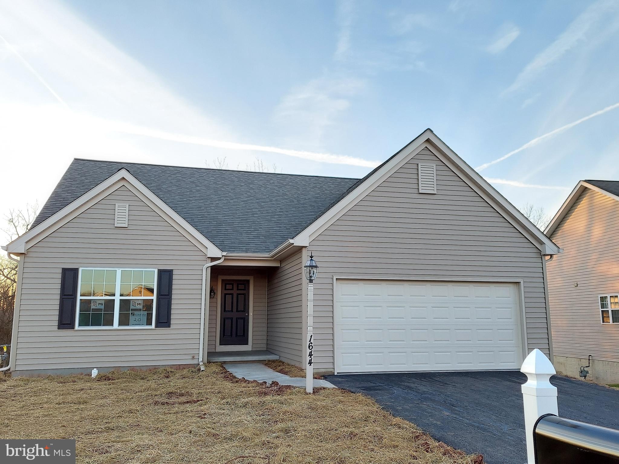 BUILD JOB! HOME IS BEING BUILT TO BUYER'S SPECS.  Here is a beautiful 3BR, 2BA Elmcrest Rancher with traditional elevation. This home showcases 1499 sq ft of elegant living space, an open floor plan, a full walk-out lower level and 2-car garage. Features hardwood flooring in the foyer, eat-in kitchen with plenty of counterspace and cabinets for storage. Mud room/laundry room off the garage, owner's suite with spacious walk-in closet and full bath with double bowl sink.  Additional 2 bedrooms and a full bath finish off the main level floor plan. Unfinished walk-out daylight basement with rough-in bath for 5' shower and sliding doors to yard.