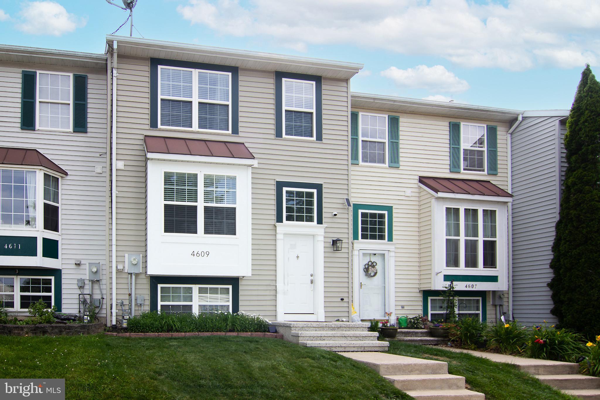 Welcome home to this beautifully maintained 3-bedroom townhouse, ideally situated on a quiet non-through street in desirable Roberts Field community. . This spacious home offers finished living space on all three levels and has been freshly painted throughout several areas. You will appreciate the curb appeal  with fresh paint, crisp walkways and entry with tall ceilings and updated lighting. The main level features a bright and spacious kitchen with an open overlook into the foyer and charming built-in as well as large picture window for great natural light.  The open  living room flows into  the adjoining  separate dining area with sliding glass doors leading to the private fenced rear yard with large deck, perfect for your outside entertaining and summer gatherings. Upstairs, you'll find three comfortable bedrooms, including a generously sized primary suite with double closets. The finished lower level provides additional flexible living space perfect for a family room, home office, recreation area, or guest accommodations. Two Assigned parking spaces convey with the property for added convenience. Don't miss this opportunity to own a move-in-ready home in a convenient location with easy access to everything you need!