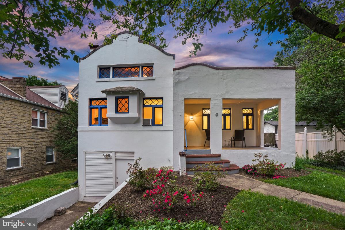 One-of-a-kind 1923 Hacienda style home in the Historic District just steps to the metro, coop, and Old Town! This home has a Mediterranean flair with a white exterior, diamond lattice windows, and vibrant blue trim. Upon arrival you are greeted by an expansive covered front porch, the perfect spot to greet neighbors. Inside you will find original wood floors, gorgeous archways, high ceilings, and vintage fixtures. The gracious living room has a decorative fireplace and a ceiling fan and opens to the large dining room with multiple archways. The eat-in kitchen has maple cabinetry, butcher block counters, gas cooking, tile flooring, an open pantry area, and access to the mudroom with a side yard entrance.

There are three bright bedrooms on the main level, two of which have direct access to the Jack and Jill bathroom with ceramic tile walls and a deep soaking tub. The primary bedroom offers a convenient wardrobe with multiple drawers and shelving. This level is complete with a charming built-in telephone niche, a nod to the home’s vintage character. 

There is a huge, floored attic with fixed stairs, a gabled roof, and potential to finish out. Downstairs is a voluminous amount of storage space; there are three separate storage rooms. One of the rooms, the workshop, has the potential to be converted into a garage. This level includes a full bathroom with a claw tub and a laundry room.

Beautiful yard with blooming azaleas and hydrangeas, the backyard is fenced and has lots of space to run about. Convenient driveway with access to lower-level storage space - workshop.

Enjoy living in this friendly, established neighborhood known for its strong sense of community and everyday conveniences. Ideally located near the co-op, restaurants, shops, and just 0.6 miles from the Takoma Park Metro Station. Experience the vibrant spirit of eclectic Takoma Park with easy access to the farmers market, entertainment, and the amenities of both Takoma Park and downtown Silver Spring.