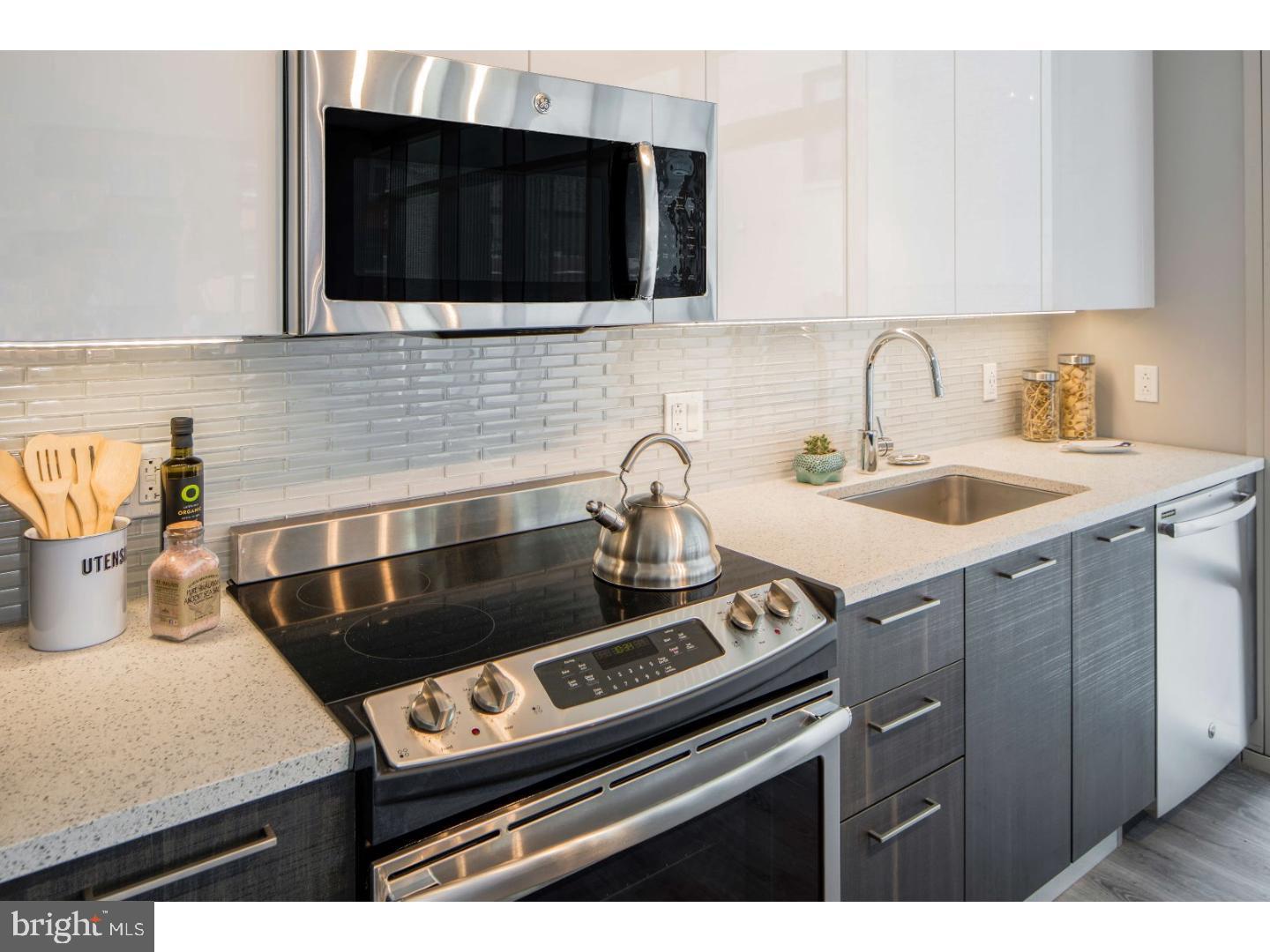This premier apartment building is located in the vibrant Midtown Village neighborhood of Philadelphia. This modern residential complex offers a perfect blend of majestic social spaces and refined personal comforts, catering to a variety of lifestyles.

The building offers a variety of apartment options, including studio, 1-bedroom, and 2-bedroom open floor plans, as well as penthouse apartments with 10-ft+ ceiling heights and upgraded finishes. Each apartment features open layouts with floor-to-ceiling windows, hardwood floors, and walk-in closets. The gourmet kitchens are equipped with energy-efficient stainless steel appliances, quartz countertops, a dishwasher, disposal, range, refrigerator, and microwave. Some units also offer a movable island option and pantry, along with frameless Italkraft Italian kitchen cabinetry. Additional amenities include in-unit Bosch washer & dryer, air conditioning, storage units, double vanities, wheelchair accessible rooms, private outdoor terraces in select residences, and MechoShade window coverings.

The community amenities are equally impressive. Residents can enjoy a 25th-floor rooftop terrace with built-in grills, TVs, and fantastic views of downtown Philadelphia, as well as an expansive second-level terrace overlooking Walnut Street. The building also features a lounge with a catering kitchen and two-sided fireplace, a game room with shuffleboard and pool table, large and small conference rooms, and an unplugged quiet lounge with Framery office pods. For fitness and wellness, there is an indoor/outdoor fitness center with a terrace and yoga studio, fitness on demand, and an elevated outdoor dog park with a private dog washing/grooming center.

Convenience and services are top priorities in this building. It offers a 24-hour concierge, cold storage for grocery deliveries, a package acceptance and locker system, and a private porte cochère entrance. Parking is available at Parkway (waitlist), and complimentary moving assistance is provided through Updater. The building is pre-wired for Comcast or Verizon cable/internet/phone service, and Wi-Fi/internet access is available throughout. It is also LEED® Silver–certified with a green roof.

The building is pet-friendly, featuring an elevated outdoor dog park and a private dog washing and grooming center.

Ideally situated just a short walk from Thomas Jefferson University Hospital, the building is surrounded by some of Philadelphia’s hottest restaurants, bars, and boutiques. Its central location in Midtown Village offers residents easy access to the cultural and social amenities of Center City, making it a perfect choice for those seeking a dynamic urban lifestyle.

* Pricing and availability subject to change on a daily basis ** Photos are of model units ** Parking may be available for additional fee **