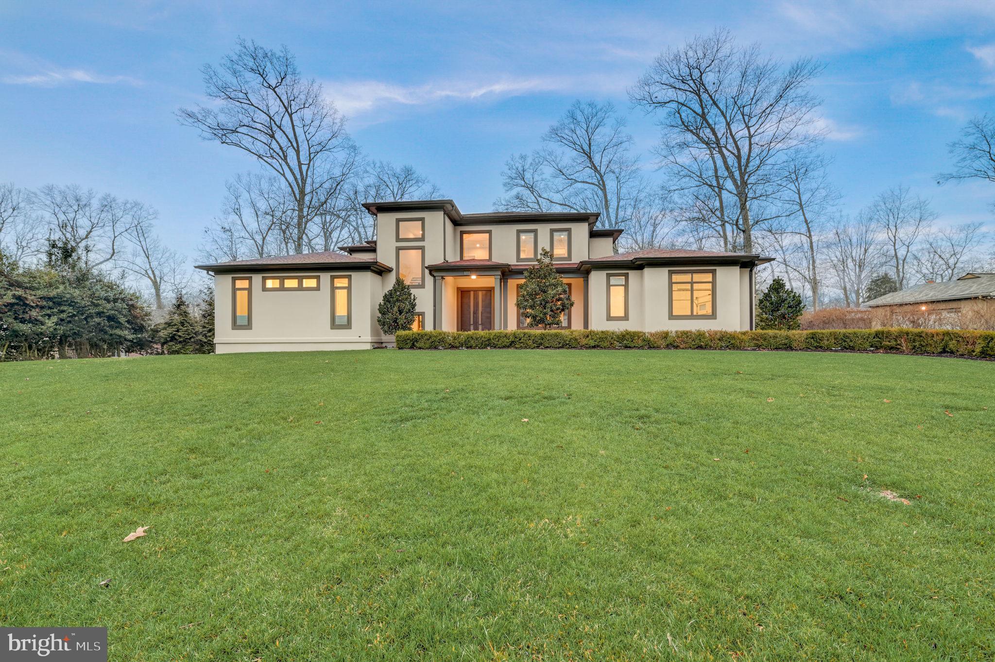 Discover the epitome of luxury living in this stunning, custom-designed masterpiece built by Castlewood Custom Builders in 2018 and boasting over 7,800 sq ft across three meticulously finished levels. Nestled on a private 0.6-acre lot within a tranquil cul-de-sac street, this architectural gem offers a perfect blend of sophistication, comfort, and practicality. Boasting 10-foot ceilings on the first floor, 8-ft doors, and Pella windows with built-in shades (architect series in common areas and designer series in bedrooms), luxurious finishes abound throughout the home. From the designer front door to the stucco exterior and screened rear porch, every detail of this home reflects careful craftsmanship and attention to detail. Spanning three levels, the practical and spacious floor plan accommodates your changing needs and has a great flow for entertaining.  The impressive two-story foyer sets the stage for the elegant living spaces to come. The main level features a formal dining room with a bright picture window. The gourmet kitchen features high-end Sub-Zero and Wolf appliances, an oversized center island with a waterfall edge, quartz countertops, and custom cabinetry. A butler's pantry with a wine refrigerator and a extra dishwasher adds convenience to your culinary experience. The breakfast area is open to the kitchen and has direct access to the large screened in porch, and direct access to the backyard, featuring mature trees and new landscaping, including a rain garden and green giant trees that boarder the property, creating a serene and private outdoor oasis. Inside, the spacious living room, adjacent to the kitchen, features pocket doors that provide flexibility for an open floor  or added privacy. The living room boasts a gas fireplace, tray ceiling with up-lighting, and floor-to-ceiling windows with picturesque views of the garden. Completing the main level are 2 bedrooms, including the primary bedroom and en-suite bathroom with dual walk-in closets, an office, a mudroom with laundry, pantry, and access to a 2-car garage. The second floor features four bedroom rooms and three bathrooms, including a buddy bath. The walk-out lower level is a haven for entertainment and features a media room, bedroom, full bathroom, exercise room, and a sizable unfinished space featuring epoxy-painted floors for added durability and low-maintenance elegance that can be finished into any space you could want or need. The home also boasts eco-friendly features such as a water purification system and bidets on all toilet seats, with four of them heated, and smart light switches, which provide convenience and energy efficiency. Completing this impressive home is a generator, Carrier HVAC units, air purifier, and a security camera system to ensure safety and comfort. EXCELLENT LOCATION Situated between 3 country clubs (Bethesda, Congressional and Burning Tree) and a stone's throw to the Cabin John Trailhead, this home is surrounded by nature yet nearby to the best of city living! Nearby to Cabin John, Potomac, Bethesda, Chevy Chase and Washington DC for premium shopping, dining and entertainment. For your everyday needs, you're a few short minutes to Balducci's Market, Giant Food Grocery Store, and Westfield Montgomery Mall. Nearby to major employers (Amazon, Gannett, Capital One, Freddie Mac, Northrop Grumman, Federal Government, to name a few) and hospitals (Suburban Hospital, Walter Reed Medical Center, and NIH Clinical Center). EASY COMMUTE The bus stop is at the entrance of the community and you're nearby to major commuter routes (River Road, Bradley Blvd, I-495, I-270 Spur).
Embark on a new chapter of refined living in this exceptional home, where every detail has been meticulously curated to offer unparalleled comfort and style. Welcome Home!