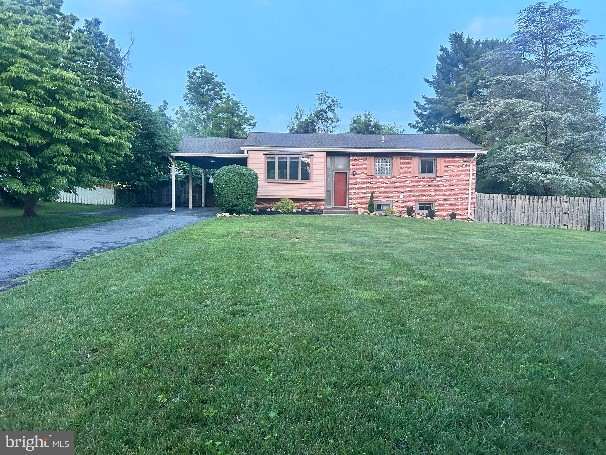 This private half-acre property offers the perfect blend of comfort, energy savings, and convenience; with no HOA. Tucked back on a quiet street, this move-in ready home features a fully owned 9.2kW solar system (2024) that significantly reduces electric bills while generating approximately $65/month in transferable Solar Renewable Energy Credit (SREC) income for the new owner, backed by a transferable 30-year warranty. Energy efficiency is further enhanced by a geothermal heat pump providing year-round comfort with lower heating and cooling costs.

The main level offers a living room, kitchen, and three bedrooms including a primary suite with an ensuite bath, plus one additional full bath. The fully renovated lower level (2024) provides two additional bedrooms, a full bath, and a family room; accessible via a second private entrance, ideal for extended family or guests.
Major updates include a new water heater (2025), roof (2021) with gutter covers (2024), renovated primary bath (2024), and updated secondary bathrooms. Smart home features include an Ecobee thermostat, Schlage smart locks on both entrances, and a motorized living room blind.

Enjoy outdoor living on a large deck overlooking a fully fenced rear yard, plus a storage shed, carport, and parking for up to 8 vehicles. Minutes from Burtonsville Crossing shopping, dining, and fitness, with access to Routes 95, 29, and 200 for commuting to Washington, DC and Baltimore.