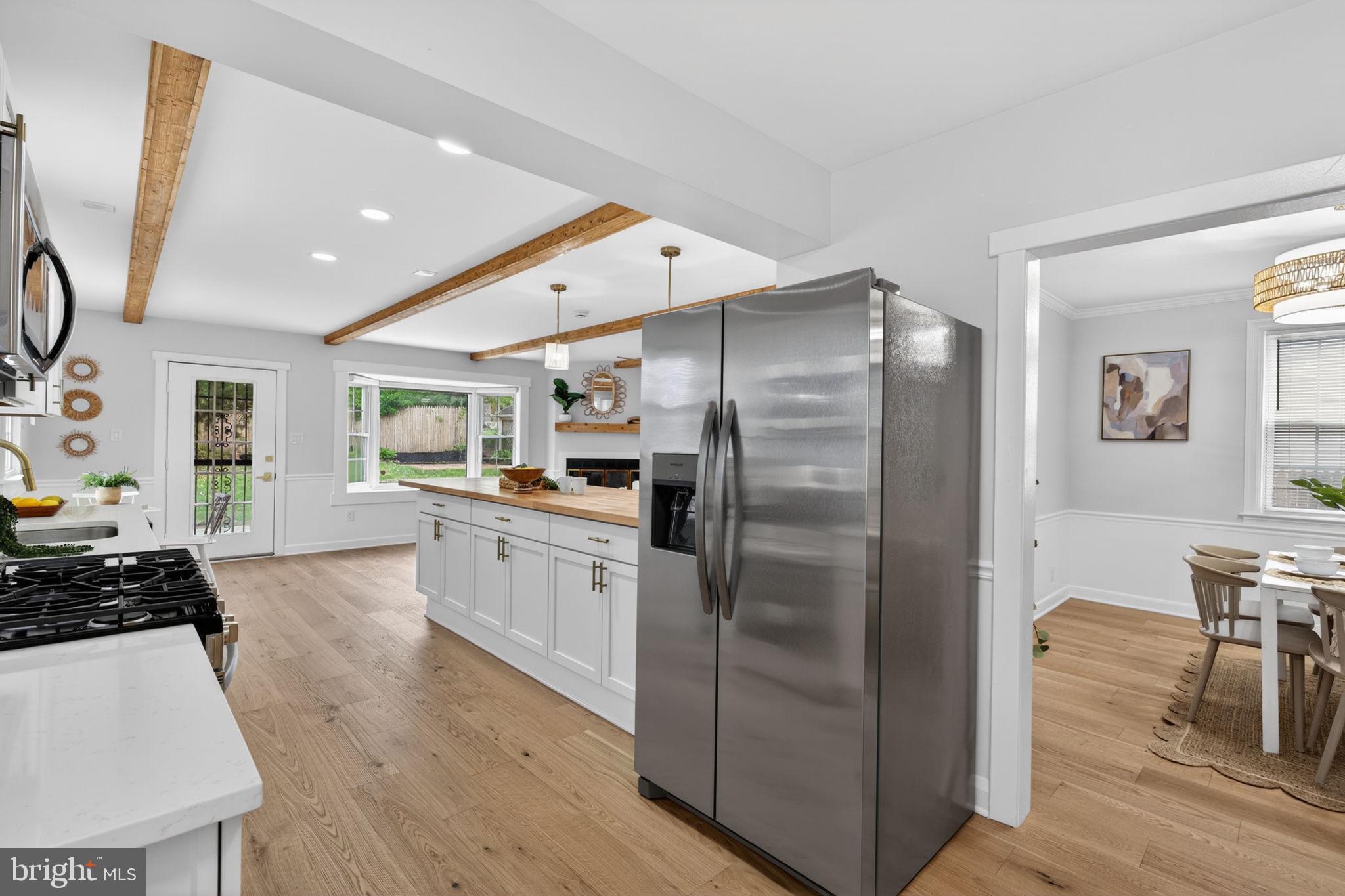 This colonial beauty is a true boho paradise, featuring a sun-drenched great room with walls of windows, hardwood floors, and a space that makes everyday living feel effortless… all just minutes from downtown Baltimore. Come see it today.

Your lifestyle starts here. Coffee on the covered front porch, quiet mornings, and a space that just feels good to come home to.

You’ve got flexibility. Three spacious bedrooms with loft space, great for kids, plus a finished basement with a full bath and private entrance: perfect for guests, work, or an extra living space.

The backyard is something special. Beautiful landscaping surrounds a serene pond with a fountain, creating a space to relax, unwind, and enjoy your own private outdoor retreat.

This is the one that feels like home the moment you walk in… don’t miss your chance to make it yours!