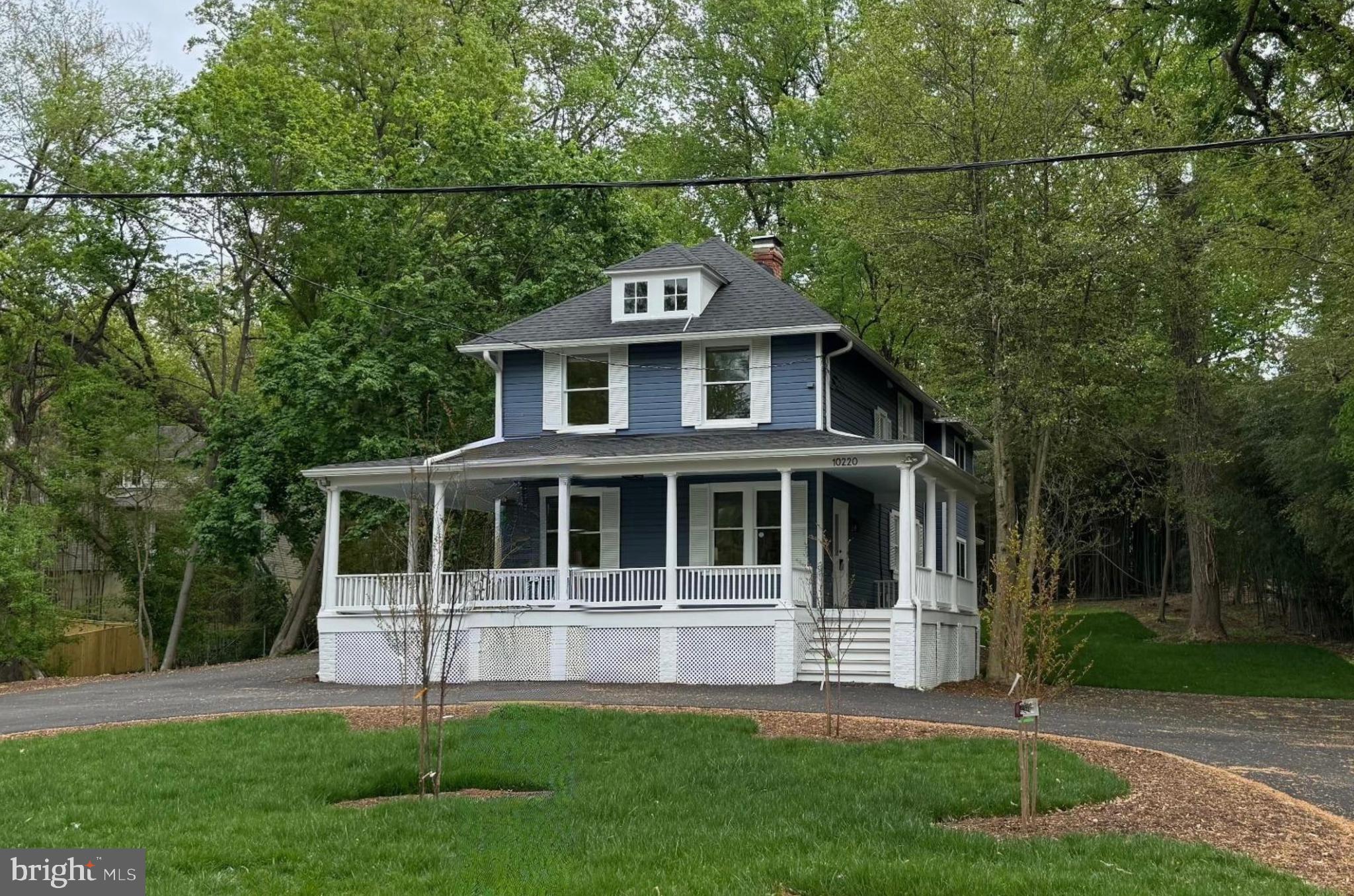 NEW Price! Motivated Seller. Please note: The new addition brings the total sq. ft of the home to 2,918. Love the charm of older homes but don’t want to give up modern conveniences? You can have it all at 10220 Capitol View Avenue. This home originally built in 1900, is sited on two lots totaling almost one acre of land. Located in historic Capitol View Park the home has been renovated and enlarged from top to bottom. The developer has kept the charm and original woodwork in the original structure but has added a large modern kitchen and family room at the rear of the building, with a generous primary suite and laundry room above. A large wraparound porch welcomes guests with entry doors on either side of the home. Enjoy the formal living room with the original wood floors which provides a great space for entertaining or lounging, and provides entry into the formal dining room with an access door to the porch and side yard. Beyond the dining room the home opens up to the stunning modern open-concept kitchen with a large breakfast bar, lots of counter and cabinet space and a family room with French doors to the rear porch and backyard. A side hallway off the dining room provides access to a new full bath and stairs to the basement. Upon entering the upper-level a hallway provides access to the convenient laundry room and half bath, and also leads to the spacious primary suite with views overlooking the serene back yard. The stunning primary bath with shower and double sink vanity, closets and warm neutral carpeting make this space a cozy escape. There are two additional bedrooms and a new full bath on this level. The lower level features a wonderful room that can be an additional bedroom, workout room, office, or recreation room with an egress window close by for safety. The utility room with new HVAC systems which includes a tankless water heater completes the lower level. A new circular driveway provides ample room for parking with parking pads on both sides of the home. This home enjoys the convenience of being close to public transportation (Ride-On bus, Metro and Marc Train), as well as the Connecticut and Georgia Avenue corridors. Enjoy restaurants, shops, Farmer’s Markets, and libraries in Silver Spring and Kensington. The location is also close to Rock Creek Park, and local parks for outdoor hiking, biking, and fun. Welcome home!