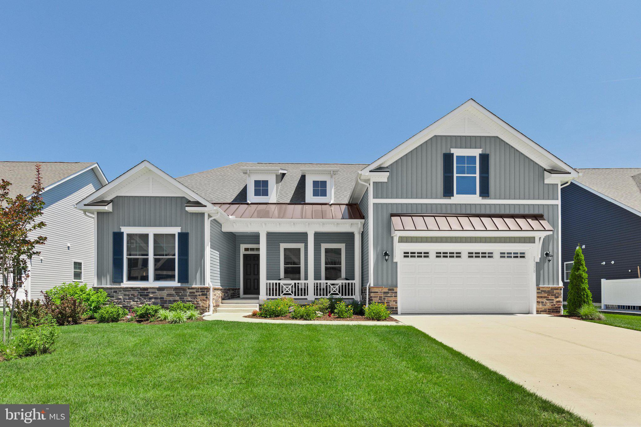 Welcome to Baylis Estates, where exceptional craftsmanship, thoughtful design, and everyday comfort come together in this beautifully appointed Insight Home. Offering three bedrooms, two-and-a-half baths, and desirable one-level living, this home impresses from the moment you arrive with timeless Craftsman-inspired architecture featuring charming dormers, standing-seam metal accent roofs, board-and-batten siding, stone accents, and a welcoming covered front porch. Inside, a wide foyer opens to an expansive, light-filled floor plan designed for both comfortable living and effortless entertaining. French doors lead to a spacious flex room ideal as a home office, study, or formal dining room. The stunning chef's kitchen is the heart of the home, showcasing quartz countertops, 42-inch cabinetry with glass-front display cabinets, a dramatic full-height custom backsplash, stainless steel range hood, gas cooktop, oversized center island with breakfast bar seating, and a walk-in pantry. The adjoining dining area flows seamlessly into a cozy sitting room nestled within a sunny bay window bump out, while the oversized rear deck extends your living space outdoors for gatherings, grilling, or relaxing evenings. The private primary suite occupies its own wing and features two walk-in closets with professionally designed California Closet systems, an additional linen closet, and a luxurious bath with dual vanities and an oversized tiled walk-in shower with built-in bench. Two additional bedrooms are thoughtfully positioned on the opposite side of the home and share a beautifully appointed full bath, offering ideal privacy for family or guests. Built with Insight Homes' renowned commitment to energy efficiency, this home includes triple-pane windows, high-performance insulation, energy-efficient ceiling fans, a manifold plumbing system, and tankless hot water. Baylis Estates offers beautifully maintained sidewalks, ponds, cul-de-sacs, a clubhouse, fitness center, and community pool, all just minutes from Route 24, with Delaware's beaches, restaurants, and tax-free outlet shopping approximately 15 miles away.