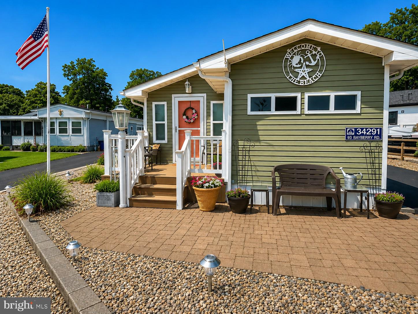 Nestled at the intersection of relaxation and adventure, this charming 3-bedroom, 1-bath coastal cottage in Bayside serves as your ideal retreat from the hustle and bustle of everyday life. Spanning a generous 1,090 sq ft, this delightful home features a welcoming front porch that invites neighborly chats and leisurely mornings with a cup of coffee, all while being conveniently located just a block away from Marina #1 and the private beach. 

Recently updated to enhance comfort and efficiency, it boasts a newer HVAC system, luxury vinyl plank floors that add a touch of elegance, and a newer roof that ensures peace of mind. The open-concept layout is designed for both relaxation and entertaining, highlighted by a decorative brick fireplace that creates a great ambiance for gatherings. The sunroom, a perfect spot to soak in natural light, leads to your private outdoor oasis, which is complete with a large deck, a charming gazebo, and an outdoor shower—ideal for rinsing off after sun-soaked beach days or hosting lively BBQs while enjoying the spectacular fireworks display from Paradise Grill. With a spacious kitchen that offers ample storage for all your culinary needs, along with a beautifully manicured yard that enhances the home's curb appeal, this partially furnished gem is truly move-in ready. It offers a seamless blend of comfort and coastal living, situated in a vibrant community brimming with amenities and outdoor activities. Embrace the Bayside lifestyle, where relaxation and adventure await at every turn!