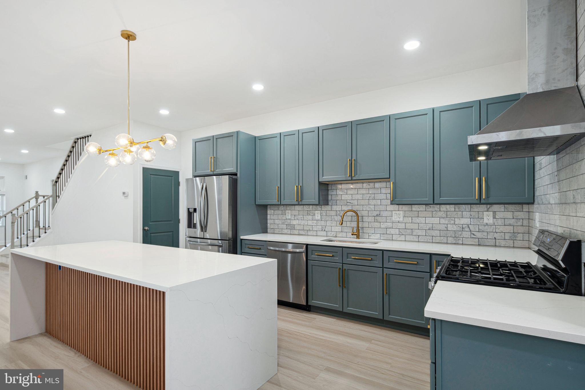Welcome to 5602 Cedar Ave, a beautifully updated Twin/Semi-Detached home blending classic character with modern upgrades. Nestled in the heart of Cobbs Creek, this stunning residence boasts 3 bedrooms, 2.5 bathrooms, and an inviting layout filled with natural light.

Step inside to discover a stylish living room featuring rich wood flooring, a large front window, and gorgeous stained glass accents above the window and front door. The open-concept flow leads seamlessly into the dining area and then into the gorgeously updated kitchen. Here, you’ll find a white island with elegant wood paneling, dark green cabinetry with gold accents, and a French door refrigerator. A gas stove with a range hood, ample cabinet and counter space, and a sleek modern light fixture complete this chef’s dream kitchen. A stylish half bath with a window adds convenience to the first floor.

Just outside the back door, a private outdoor space awaits—perfect for hosting gatherings or unwinding on warm summer days.

Upstairs, the gorgeous stairwell leads to three well-appointed bedrooms and two full bathrooms. The primary suite features a beautiful bay window, elegant wood flooring, and stylish dark green-accented closet doors. The primary bathroom is a luxurious retreat with a double sink vanity, large mirror, walk-in glass shower, a waterfall showerhead, and stunning tile work. The second bathroom offers a shower/tub combo, while the two additional bedrooms provide ample space and charm.

The basement offers endless potential—use it as a home gym, storage area, or flex space. Outside, a nicely sized front porch and a beautiful blue front door enhance the home’s curb appeal.

Don't miss the chance to own this gorgeous Cobbs Creek gem—schedule your showing today!