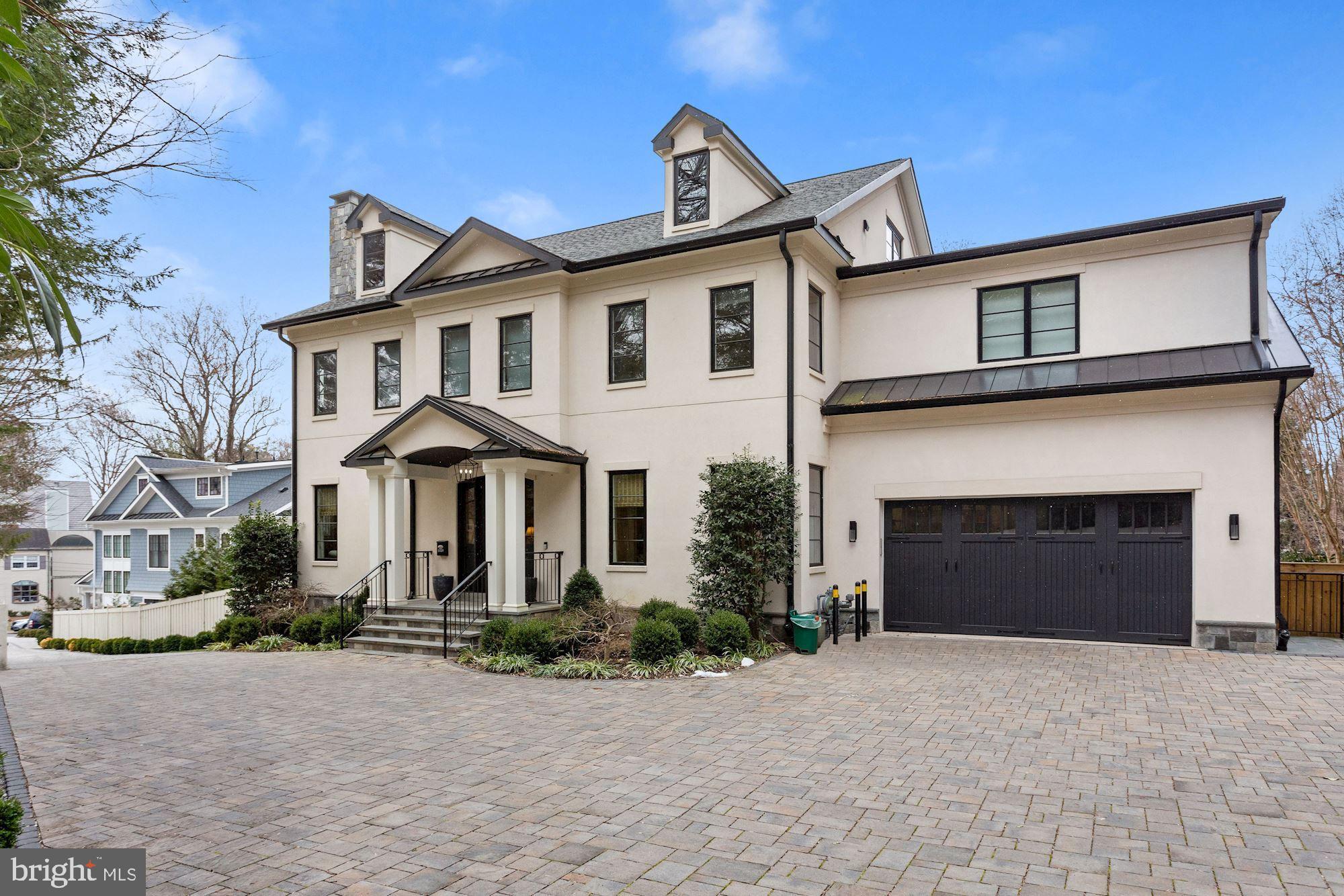This one has it all!! Set privately off the street, this Kent residence was built in 2018 by AR Custom Builders. Boasting an inviting yet private 1/2 acre setting there are 8,250 square feet of modern living across four levels. Showstopping features include an elevator, rooftop terrace, finished lower level with gym, two 2-car garages and a pool. An elegant living and dining room flank the foyer and a spacious eat-in kitchen with island opens to a light-filled family room with gas fireplace. A butlers’ pantry with beverage fridge adds ample storage. French doors span the rear of the home, making for great views and easy access to the outdoors. A mudroom, office and powder room complete this level. The second level includes a large primary suite with private sitting room, en-suite bath with rain shower, soaking tub and a stunning walk-in closet. This level contains three additional bedrooms, all with en-suite bathrooms, and a dedicated laundry room. The upper level offers gorgeous neighborhood views accessible from the rooftop terrace. There is a large family room with wet bar and another bedroom and bathroom. The fully finished lower level offers a recreation space, gym, bedroom and bathroom and access to the backyard. The outdoor spaces offer a perfect space for entertaining and family living, with multiple terraces, lower level flagstone lounge area, and large pool.