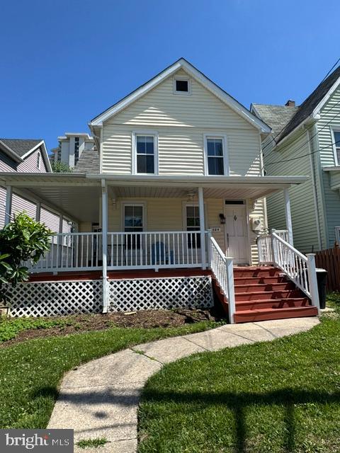**Professional photos to be uploaded prior to going on the market** Charming 2-bed, 1-bath single-family home in the heart of Towson — walkable to shopping, dining, and downtown. Classic curb appeal with a welcoming wraparound front porch perfect for morning coffee or evening relaxation. Inside, beautiful hardwood floors flow through bright, well-proportioned rooms, large kitchen and separate dining area, plus a cozy gas fireplace in the family room, perfect for those cold winter days.  Recent updates include a new roof finished with durable black architectural shingles for long-lasting curb appeal and low maintenance. Ideal for first-time buyers, downsizers, or investors seeking a centrally located home with character and convenience. Don't miss this Towson gem at 309 Lennox Ave.
