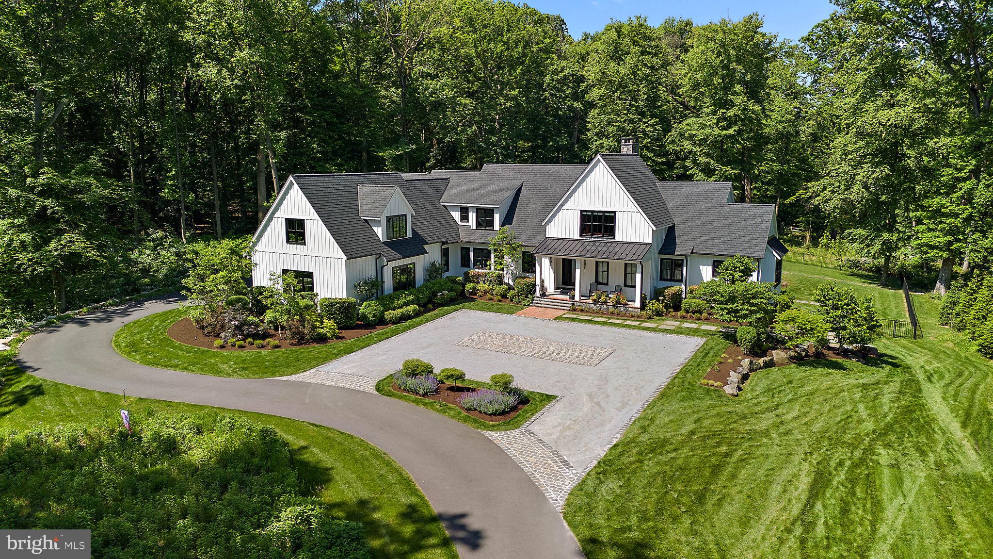 420 Campbell in Greenville, DE, is a stunning modern farmhouse designed for those who
appreciate luxury, space, and innovation. With 7,284 square feet of living space, this home
offers five bedrooms, five full bathrooms, and two half-baths, all situated on a sprawling 3.03-
acre lot. Designed and built by Dewson Construction, known for its impeccable craftsmanship, this
residence blends old-world charm with modern amenities. From the expansive gourmet kitchen
to the fully finished lower level with a movie theater, this home is designed for relaxation and
entertainment.
Step into a spacious living room with soaring ceilings, rustic hardwood floors, and a grand
fireplace, making it perfect for cozy gatherings. The gourmet kitchen is a chef's dream, featuring
a Wolf gas range, Sub-Zero fridge, and custom cabinetry. 
The primary suite offers a luxurious
retreat with a private terrace, spa-like bathroom, and custom walk-in closet. The outdoor space
is just as impressive, with multiple decks, a fire pit, and a high-fidelity multi-zone audio system
to enhance your outdoor living experience.
This smart home features cutting-edge technology, including energy-efficient systems, multi-
zone audio, and a Control 4 home automation system. The home's private fitness center,
oversized sauna, and dedicated entertainment spaces offer an unmatched level of comfort and
convenience.
For those in search of a private oasis in one of Delaware's most sought-after communities,
420 Campbell is the home you've been waiting for. Don't miss your chance to experience this
unique property—schedule your private tour today!