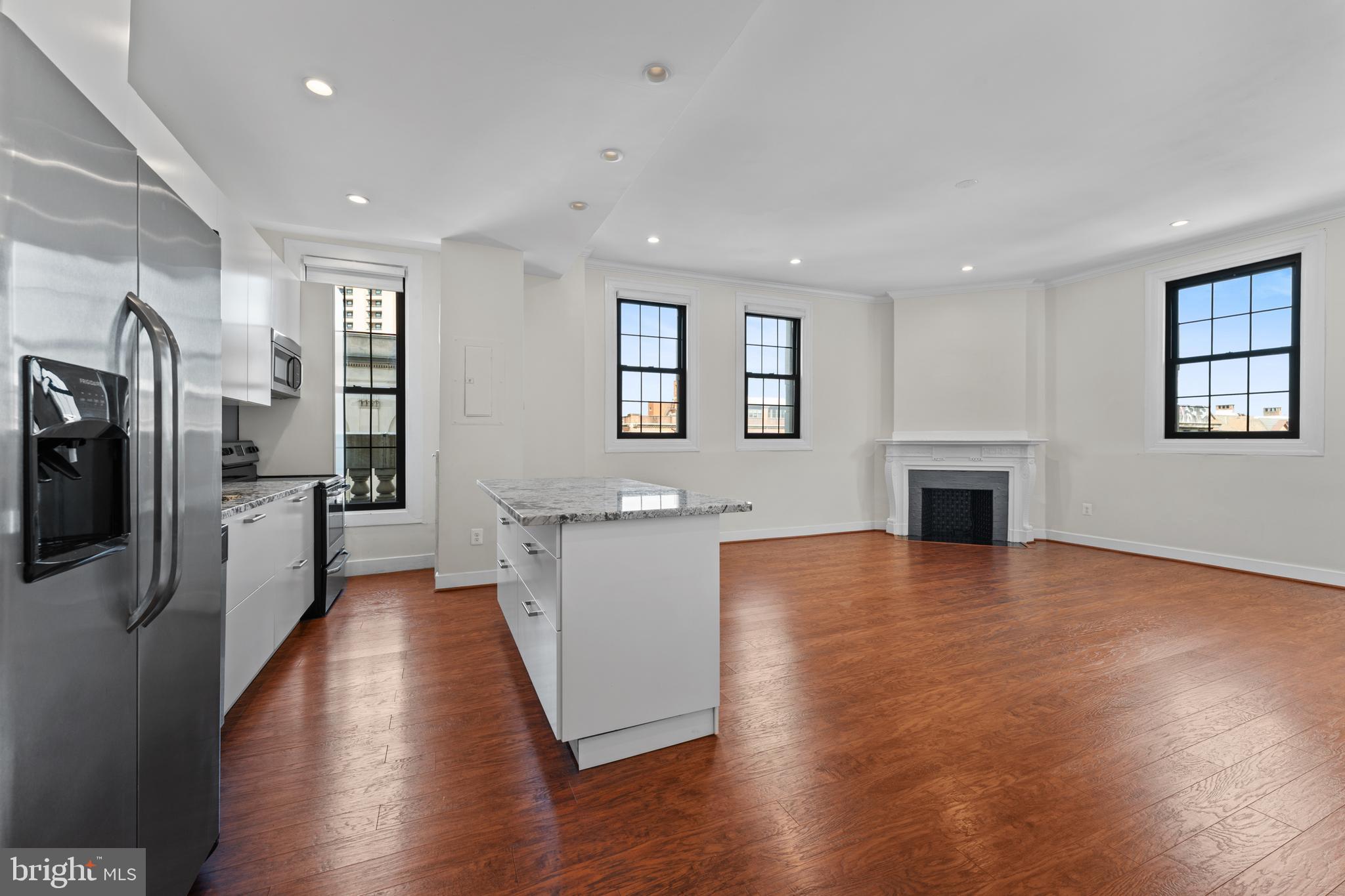 Welcome home to the iconic The Belvedere, where historic charm meets modern luxury. This beautifully maintained and fully renovated 2-bedroom, 2 full bath residence offers sophisticated city living at its finest. Renovated from wall to wall, this stunning condo features an expansive open-concept layout, a beautifully designed kitchen with a spacious island, granite countertops, stainless steel appliances, and the added convenience of an in-unit washer and dryer—perfect for effortless everyday living. Enjoy two tastefully renovated bathrooms, generously sized bedrooms with soaring ceilings, a charming decorative fireplace, and an abundance of natural light that fills the home throughout. Residents of The Belvedere enjoy 24-hour lobby service for added security and convenience, along with access to the building’s remarkable historic amenities, including grand ballrooms, the elegant John Eager Howard Room, the legendary Owl Bar, a 13th-floor lounge with breathtaking city views, and a unique lower-level shopping arcade. Ideally located near some of Baltimore’s finest dining, shopping, entertainment, and everyday conveniences, this is urban living at its absolute best. Schedule your private tour today!