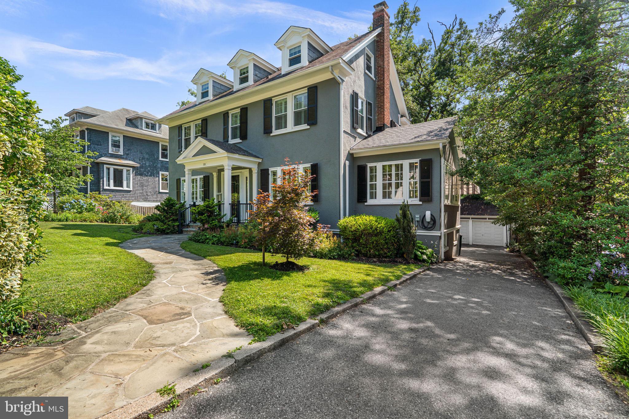 Set on a picturesque street in Old Catonsville, this beautifully maintained center hall Colonial offers timeless character, thoughtful updates, and over 2,300 square feet of inviting living space. Blending classic architectural details with modern conveniences, this four-bedroom, two-and-a-half-bath home has been lovingly cared for and thoughtfully improved over the years, creating a home that is as comfortable as it is impressive.

A welcoming entry opens to beautifully refinished wood floors that extend throughout the main level, setting the tone for the warmth and quality found throughout the home. The spacious living room features elegant crown molding and a gas fireplace, creating a comfortable gathering space, while the dining room also showcases crown molding and provides the perfect setting for everyday meals or special occasions. Just beyond the living room, the sunroom offers a bright and relaxing retreat.

The expanded kitchen, remodeled in 2016, is designed for both everyday living and entertaining. Quartz countertops, stainless steel appliances, abundant cabinetry, a large center island with space for seating, updated lighting, and a heated tile floor combine style and functionality. A striking wall of windows fills the space with natural light while overlooking the backyard, and direct access to the large deck makes indoor-outdoor entertaining effortless. A conveniently located half bath completes the main level.

Upstairs, the spacious primary suite features a large walk-in closet and a private bath added in 2015. Two additional generously sized bedrooms share a beautifully updated hall bathroom. The remodeled third floor includes a versatile fourth bedroom and an additional room ideal for a home office, studio, or extra storage.
The partially finished lower level offers flexible living space, abundant storage, and a rough-in for a future bathroom, providing opportunities to customize the space to meet your needs.

Outside, the beautifully landscaped backyard with its lush gardens creates a peaceful setting for relaxing or entertaining on the large deck. A long driveway, complete with a dedicated EV charger, leads to the detached two-car garage, adding both convenience and practicality to this exceptional property. 

Numerous updates throughout the years reflect the exceptional care this home has received, including refinished hardwood floors, replacement windows, central air conditioning, updated kitchen and baths with heated floors, exterior painting, a replaced water heater, updated furnace, garage doors, and more. Located just a short walk or drive from Catonsville's popular shops, restaurants, parks, and community events, with easy access to I-695, I-95, and Baltimore's many attractions, this exceptional home offers the perfect combination of historic charm, modern updates, and an unbeatable location. Verify school information on the Baltimore County Public Schools website.