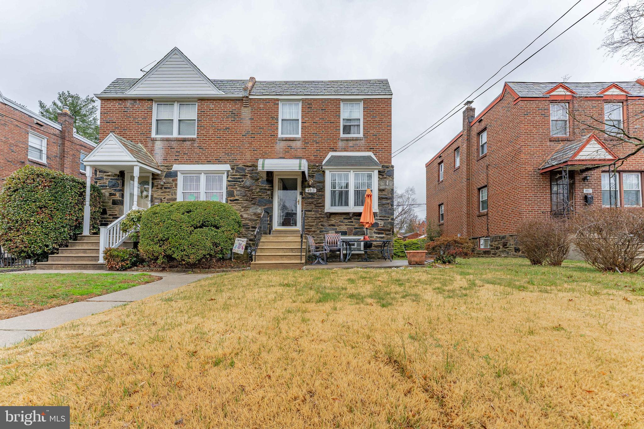 Welcome to 4913 Woodland Avenue, a 3-bedroom, 1.5-bath twin home in Drexel Hill. As you approach, a front patio welcomes you to the home and provides a comfortable outdoor sitting area. Inside, the living room features luxury vinyl plank flooring, a large double front window that brings in natural light, and a convenient coat closet. The adjoining dining room continues the updated flooring and creates an easy flow for everyday living and entertaining. The kitchen is thoughtfully updated with quartzite countertops, stainless steel appliances, soft-close white cabinetry, a glass subway tile backsplash, and sliding doors leading to the rear wood deck, creating a seamless indoor-outdoor connection. Upstairs, the primary bedroom includes carpet flooring, a ceiling fan with light, and a mirrored walk-in closet. Two additional bedrooms, both with carpet flooring and ceiling fans, provide flexible space for family, guests, or a home office. A full hall bathroom with tile flooring and a tub and shower combination completes this level. The partially finished lower level adds additional living space and includes carpet flooring, a closet beneath the staircase, and an additional storage closet. A powder room with a single sink vanity is also located on this level. The unfinished section includes the laundry area with a utility sink and access to the garage located beneath the deck. Conveniently located near the Drexeline Shopping Center, local parks, restaurants, and entertainment, this home also offers easy access to Route 476 for commuting. Don’t miss the opportunity to make 4913 Woodland Avenue your new home.