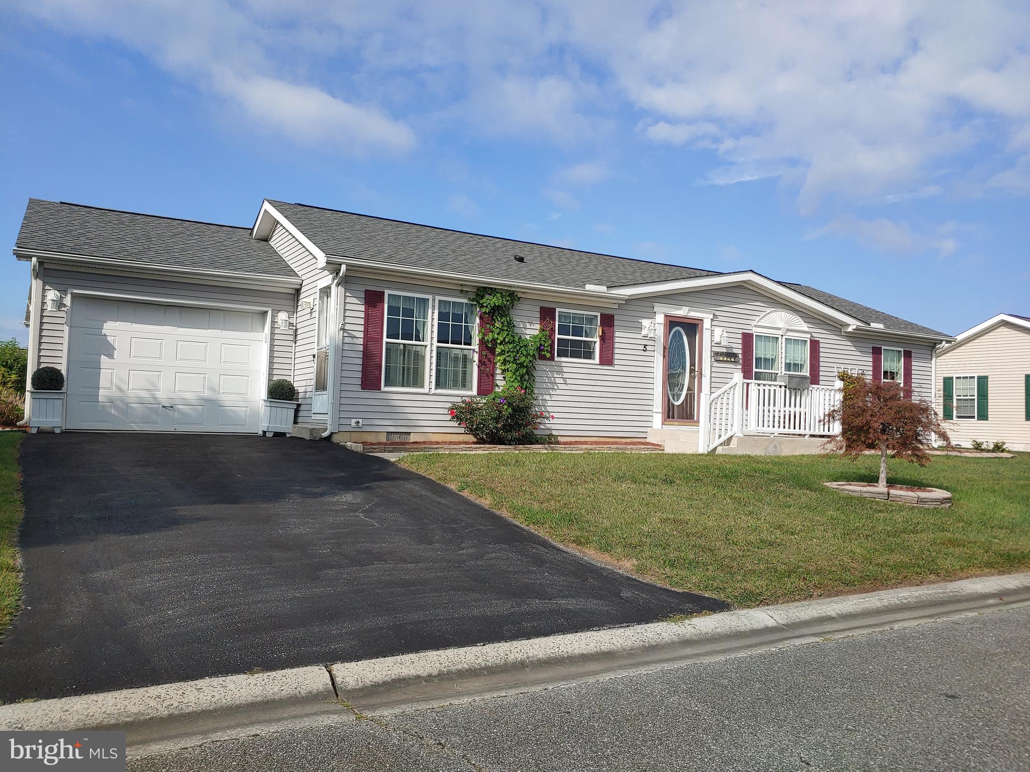 Welcome to MOVE IN READY 5 Michele Drive in the most desirable active 55+ adult community - Wild Meadows. Recent upgrades include a new roof, custom handicapped accessible shower in master bath,  HVAC and carpet in MBR.  Kitchen with Solid Surface Countertops, Side by Side refrigerator w/ Ice Maker, Ceiling Fan/Light in all rooms.  Storage galore!   INTERIOR Just PROFESSIONALLY PAINTED!      A large attached garage provides parking for one car as well as additional storage. Monthly land lease  includes lawn mowing and access to Wild Meadows clubhouse where you can find a heated pool, hot tub, gym, library and many community activities.  Convenient access to historic downtown Dover, hospitals, shopping , dining and entertainment. Only an hour drive to Delaware beaches. Buyer must apply and be approved by Wild Meadows/RHP and pay all transfer fees.   Owner anxious to settle estate.