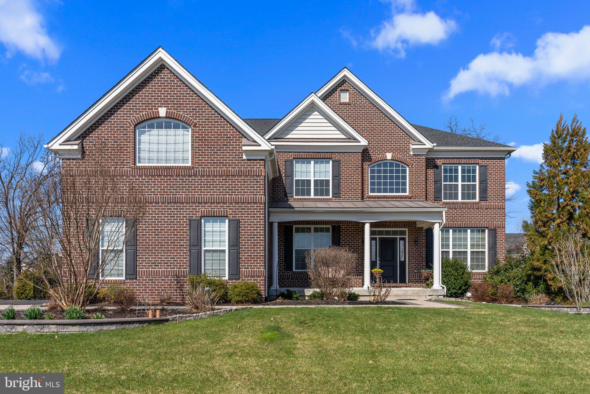 SHOWINGS BEGIN FRIDAY. Step into luxury with this meticulously crafted 7 years young Duke Lexington model by Toll Brothers boasting over $200K in upgrades in the highly desirable neighborhood of Warrington Glen. Located in Bucks County and within the prestigious Central Bucks School District, this fantastic open concept home offers 4 bedrooms, 3 full and 1 half baths across 4,455 square feet of magnificence.

Set on a beautifully landscaped picturesque .35 acre lot with stunning curb appeal and upgraded hardscaping, enter the covered front porch and step inside and gaze at the gorgeous two-story foyer with crystal chandelier and curved staircase with custom runner, wainscoting, and beautiful hardwood floors throughout the whole first floor. To your right is the formal living room adorned with trendy wainscoting and crown molding. Through the 15 pane glass French doors is a generously sized private office/study, ideal for those who work from home.

The two-story family room is impressive, featuring a cozy gas fireplace with floor-to-ceiling stone hearth and loads of natural light from the many windows. In addition to recessed lighting is a lovely statement chandelier. This room flows seamlessly into the gourmet kitchen making this the ultimate entertaining space. The enormous kitchen is truly a chef's delight, boasting upgraded cabinetry including corner glass cabinets equipped with accent lighting, granite countertops, stone backsplash, stainless-steel appliances, gas cooking, pantry, and a massive center island with breakfast bar and pendant lighting. There is plenty of space for the largest of tables in this upgraded in size eat in kitchen area with glass sliding doors overlooking the private and fully fenced rear yard with expansive paver patio and pergola. Continuing on is a separate formal dining room featuring crystal chandelier, wainscoting and crown molding, spacious enough to seat large gatherings for the holidays. Finishing off the main level is a powder room and mud/laundry room with laundry tub sink. 

Head upstairs and find yourself on a grand landing of hardwood flooring with posts and curved balcony overlooking the main living area. Down the long and wide hall that is flanked with crown molding for added elegance, enter through the double doors and find yourself in the owner's suite of your dreams. This is a pure oasis with tray ceiling and fan, sitting room, dressing area with 3 walk in closets, and a built in vanity. The double door spa-like ensuite has dual sink areas with granite counters, soaking tub with large arched window for natural light, frameless glass stall shower and a water closet. Bedroom 2 is a princess suite with tub shower combo, and two additional spacious bedrooms are down the hall that share another full bath.

The full basement offers loads of space for future finishing, or use for a home gym or for all of your storage needs. This exquisite home also features high ceilings throughout all levels, irrigation system, security system with nest cameras, 2 zones of heating and cooling, whole house water filtration system, passive radon system, and three car garage with epoxy coated floor and 50 AMP outlet for an EV charger. Conveniently located near tons of shopping and dining, Routes 202 and 309, and the PA Turnpike, this home offers the perfect combination of luxury, comfort, and convenience. Don't miss your opportunity to own this exceptional property! 1-YEAR HOME WARRANTY INCLUDED for added peace of mind!