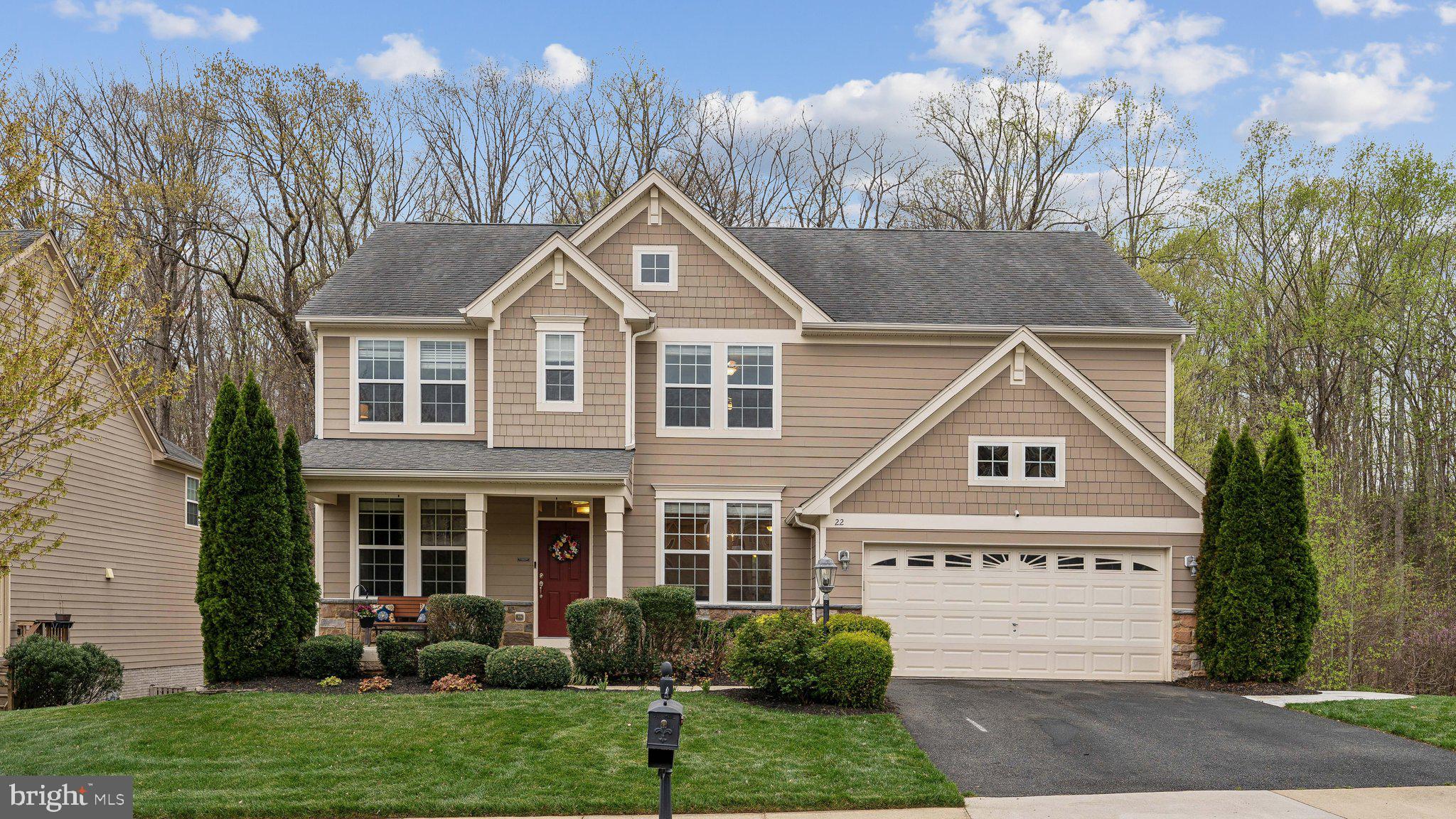Stunning Colonial with Luxurious Upgrades & Private Backyard!

Welcome to this gorgeous colonial home, featuring Hardie Plank siding and stone for timeless curb appeal.

Inside, luxury hardwood floors span the entire main level, staircase, and upper hallway. The gourmet eat-in kitchen is a chef’s dream, boasting a center island, granite countertops, stainless steel appliances, a new gas cooktop, double wall oven, beverage fridge, pendant lighting, and a stylish tile backsplash.

Step outside to a spacious deck or follow the stamped concrete sidewalk leading to the backyard patio—ideal for entertaining or relaxing in a peaceful setting. The fully fenced backyard offers privacy and includes a playset, making it perfect for outdoor enjoyment. Nestled against wooded privacy, this home blends elegance and comfort with modern upgrades throughout.

The oversized primary suite is a true retreat, featuring new plush carpeting and a completely remodeled upscale bath with a deep soaking tub, double sinks, a walk-in shower with tile floors and walls, and an expansive walk-in closet. Each upper-level bedroom also includes a walk-in closet, providing ample storage space.

The fully finished walkout basement adds even more living space, featuring a large rec room, exercise area, extra-large storage closet, a 5th bedroom, and a full bath. Luxury vinyl plank flooring enhances the modern feel, while upgraded lighting brightens the entire level.  Additional Highlights include,  Gas fireplace with mantle in family room, Upper-level laundry room with front-load washer, dryer, and storage cabinet, Recessed lighting & ceiling fans throughout, Beautiful landscaping & welcoming front porch, Alarm system for added security, Ceramic tile in all bathrooms, Located just minutes from I-95, Quantico, and Route 1, this home offers both convenience and tranquility. This one won’t last long—schedule your private showing today!