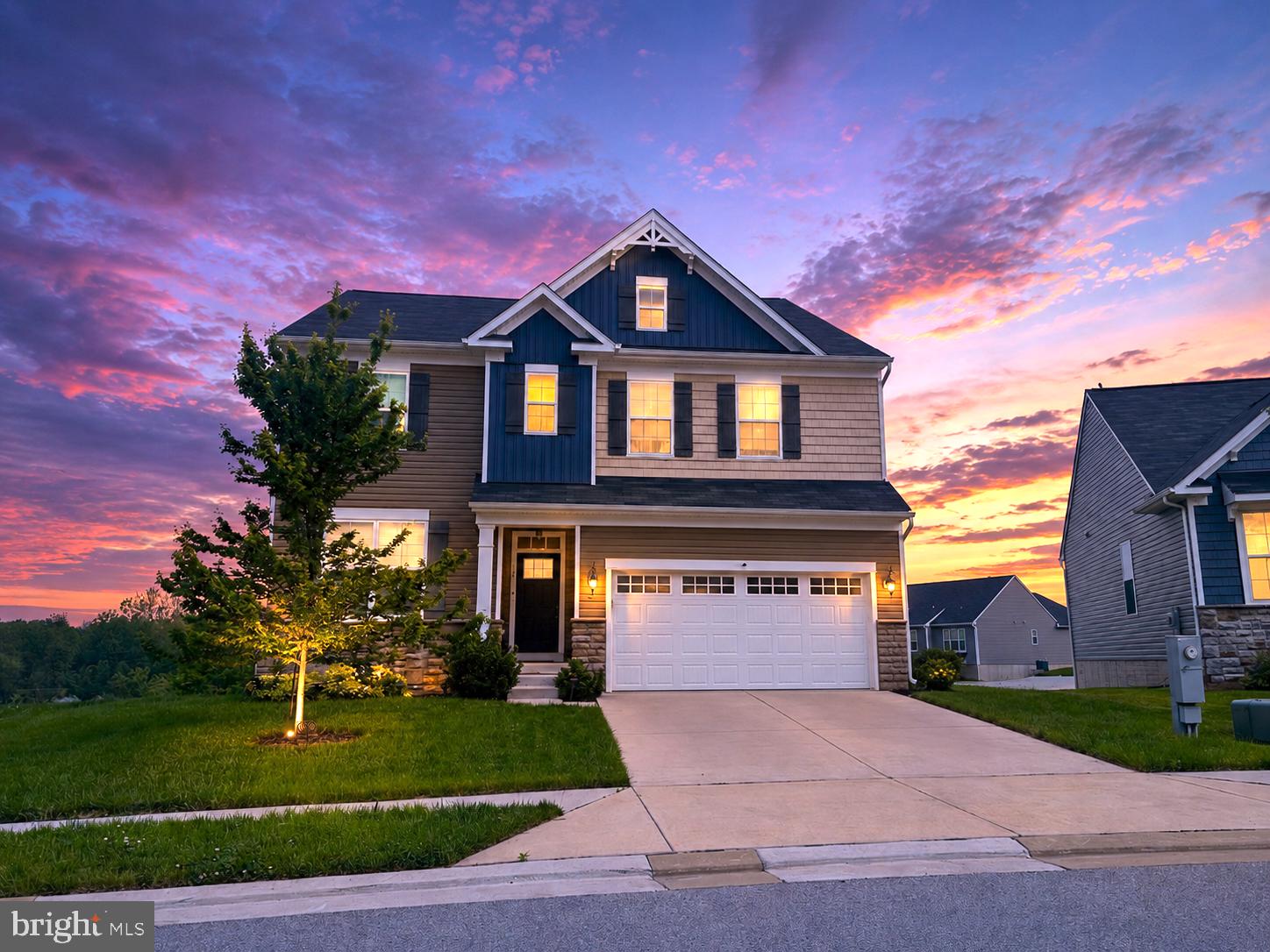 Luxury, modern design, and breathtaking pond views come together in this exceptional 5-bedroom 3,908 Sq Ft home built in 2020 in one of Taneytown’s most desirable communities.  Offering an open-concept layout, upscale finishes, and thoughtful upgrades throughout, this home is designed for today’s lifestyle while delivering timeless elegance.

Step inside the welcoming hallway  and be captivated by the dramatic two-story stone fireplace that anchors the spacious living room, creating a stunning focal point filled with natural light. The gourmet kitchen is a chef’s dream, featuring crisp white cabinetry, an oversized quartz island perfect for entertaining, a built-in wall oven and microwave combination, premium finishes, and a separate dining area ideal for family gatherings. A convenient mudroom connects the kitchen to the attached two-car garage, while a full bathroom on the main level provides added flexibility for guests or multi-generational living.

Upstairs, retreat to the luxurious owner’s suite overlooking the tranquil pond, where spectacular sunset views create the perfect ending to every day. The suite boasts an elegant tray ceiling, an expansive walk-in closet with custom built-ins, and a spa-inspired owner’s bath featuring a highly desirable wet room design. A conveniently located bedroom-level laundry room simplifies daily living. Two additional oversized bedrooms each offer walk-in closets and share a stylish Jack-and-Jill bathroom.

The fully finished lower level expands the living space with a spacious recreation/family room that walks out to the patio, plus a fifth bedroom with a walk-in closet, making it perfect for guests, a home office, fitness room, or in-law suite.

This home is loaded with premium UPGRADES  rarely found in new construction, including:
Statement avant-garde chandelier, the whole-house water filtration system with reverse osmosis, Touch-free sensor faucets throughout the home, Smart Touchstone refrigerator, Luxury finishes and modern technology designed for effortless living

Enjoy peaceful pond views, incredible sunsets, generous living spaces, and sophisticated upgrades while remaining conveniently located near shopping, dining, schools, parks, and major commuter routes.

This move-in-ready luxury home offers the perfect combination of style, comfort, technology, and location—schedule your private showing today before this exceptional opportunity is gone!