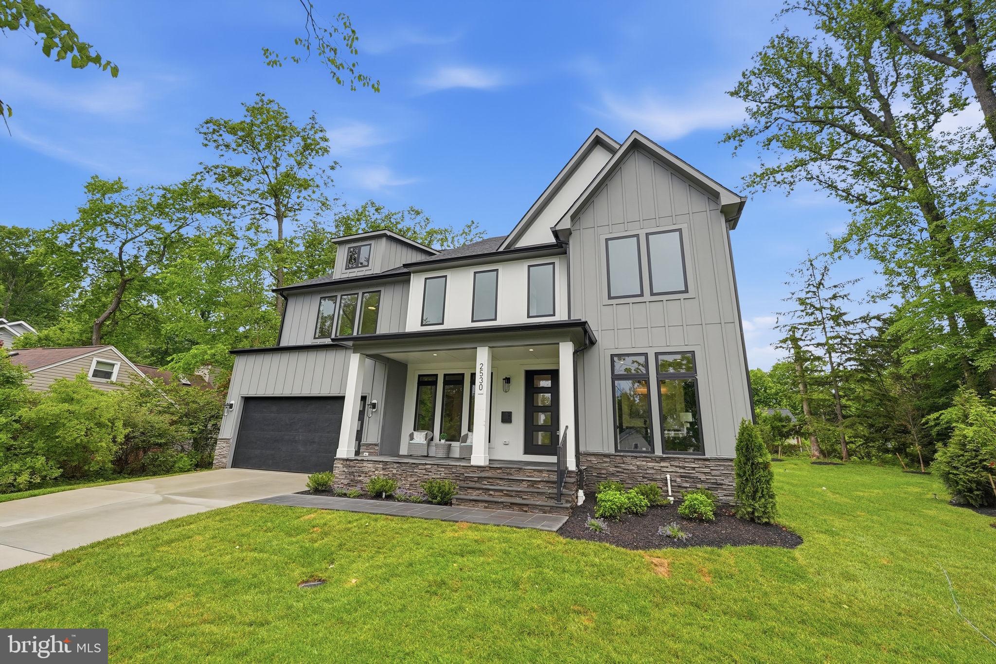 If you have been searching for a modern and luxurious home in a truly special setting, your search ends here. Set on a beautifully landscaped 0.32-acre flat lot, this stunning home offers approximately 7,200 square feet of thoughtfully designed living space across three finished levels. An elevator shaft is already in place on each level, making future installation simple and giving this home a level of long term flexibility that is rarely found.

The chef’s kitchen is the true heart of the home, featuring an oversized Quartz waterfall island, a professional 48” JennAir range with 6 burners and infrared griddle, pot filler, 48” JennAir refrigerator,  and a generous walk-in pantry. A dedicated scullery with a second dishwasher, beverage cooler. and prep sink. The space opens naturally into a warm and inviting family room with a gas fireplace, and a formal dining room sits just nearby for more special occasions. The main level is built for the way people actually live. The chef’s kitchen is the true heart of the home, featuring an oversized Quartz waterfall island, a professional 48” JennAir range with 6 burners and infrared griddle, pot filler, 48” JennAir refrigerator, beverage center, and a generous walk-in pantry. A dedicated scullery with a second dishwasher, beverage cooler, and Quartz counters keeps the main kitchen looking flawless while you host. The space opens naturally into a warm and inviting family room with a gas fireplace, and a formal dining room sits just nearby for more special occasions. Multi-panel sliding doors lead from the main living area out to a covered deck, creating that seamless indoor outdoor connection that is so hard to find. Whether you are hosting a summer gathering or simply enjoying a quiet evening, the transition from inside to outside feels completely natural. A private main level office, a powder room, and a spacious en-suite bedroom with a walk in closet complete the main level and make it especially well suited for guests or multi-generational living.

Upstairs, the primary suite is genuinely impressive. Tray ceilings, two custom walk-in closets, and a spa bath with a dramatic wet room featuring dual shower heads and body sprays, a soaking tub, dual vanities, and two separate water closets make this a true retreat. Three additional en-suite bedrooms and a well-appointed laundry room round out the upper level.

The walk-up lower level adds tremendous value with a well equipped wet bar, spacious rec room, dedicated media room, gym, and a sixth bedroom with a full bath. There is room here for everyone and every occasion. 

Walking distance to top dining and shopping in Falls Church City,  easy access parks, the W&OD Trail, and major commuter routes. Zoned for McLean High School, Longfellow Middle School, and Timber Lane Elementary in 2026.